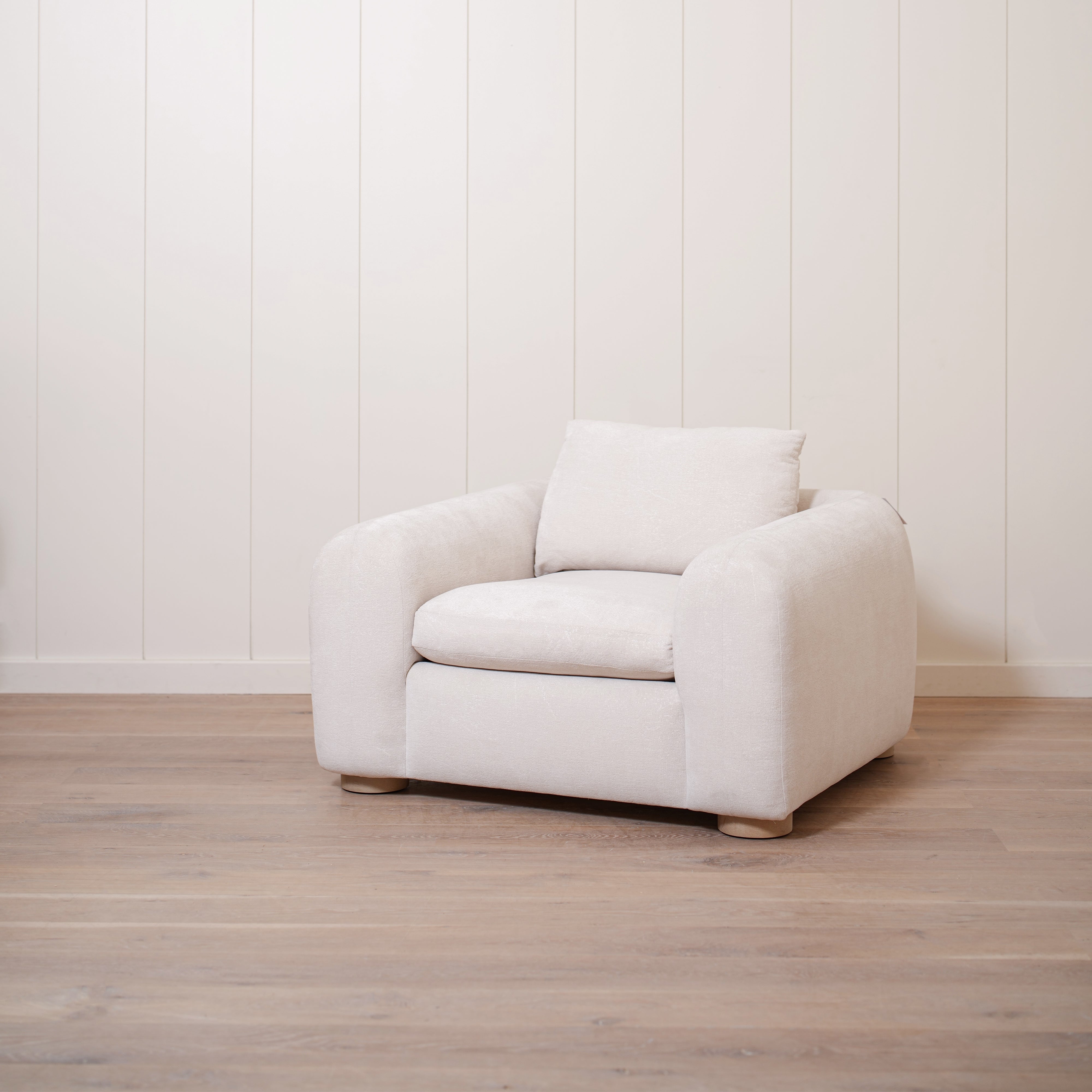 As Shown in Upholstered Barney Stone, Oak Round Legs finished in Cashmere Brown (Discontinued Finish)