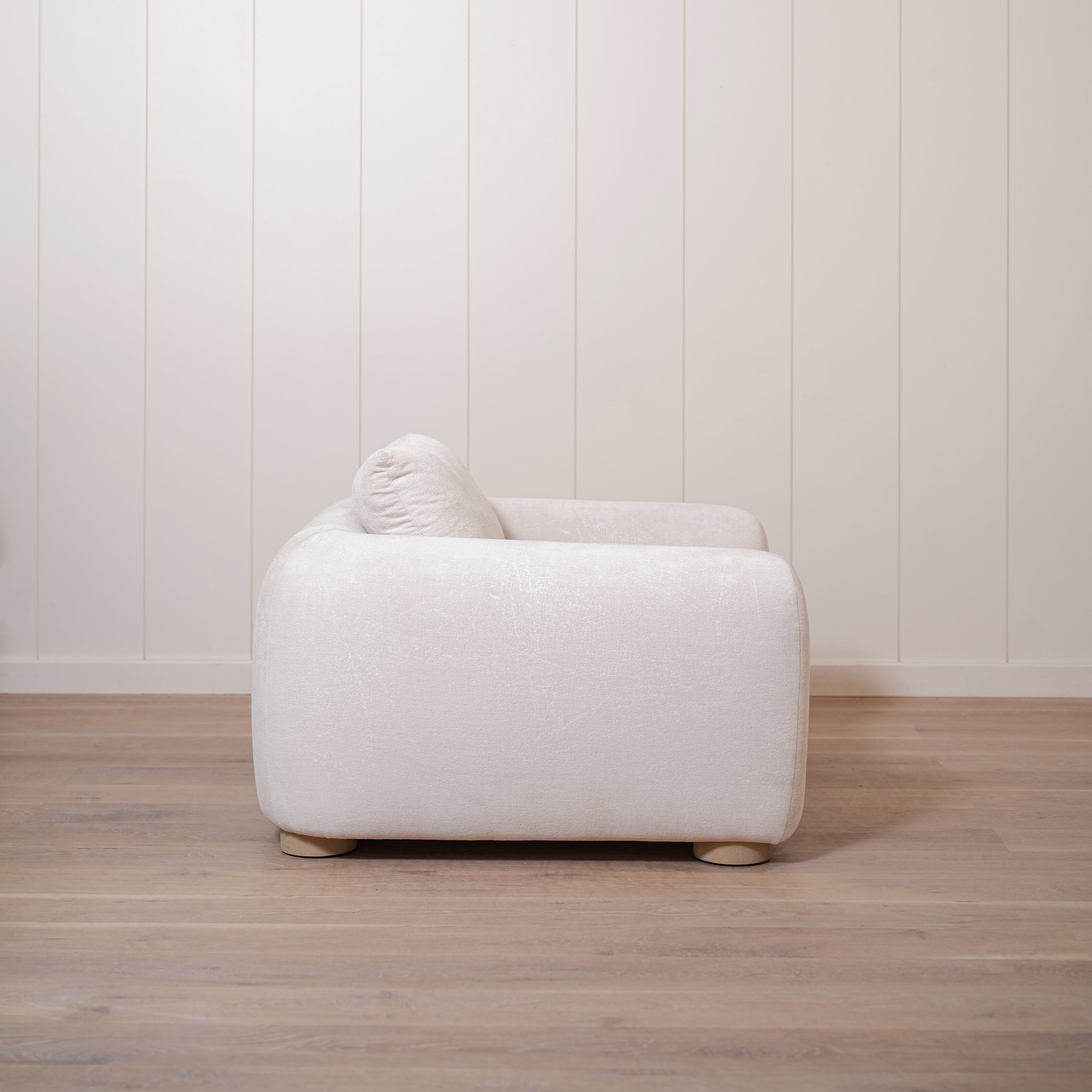 As Shown in Upholstered Barney Stone, Oak Round Legs finished in Cashmere Brown (Discontinued Finish)