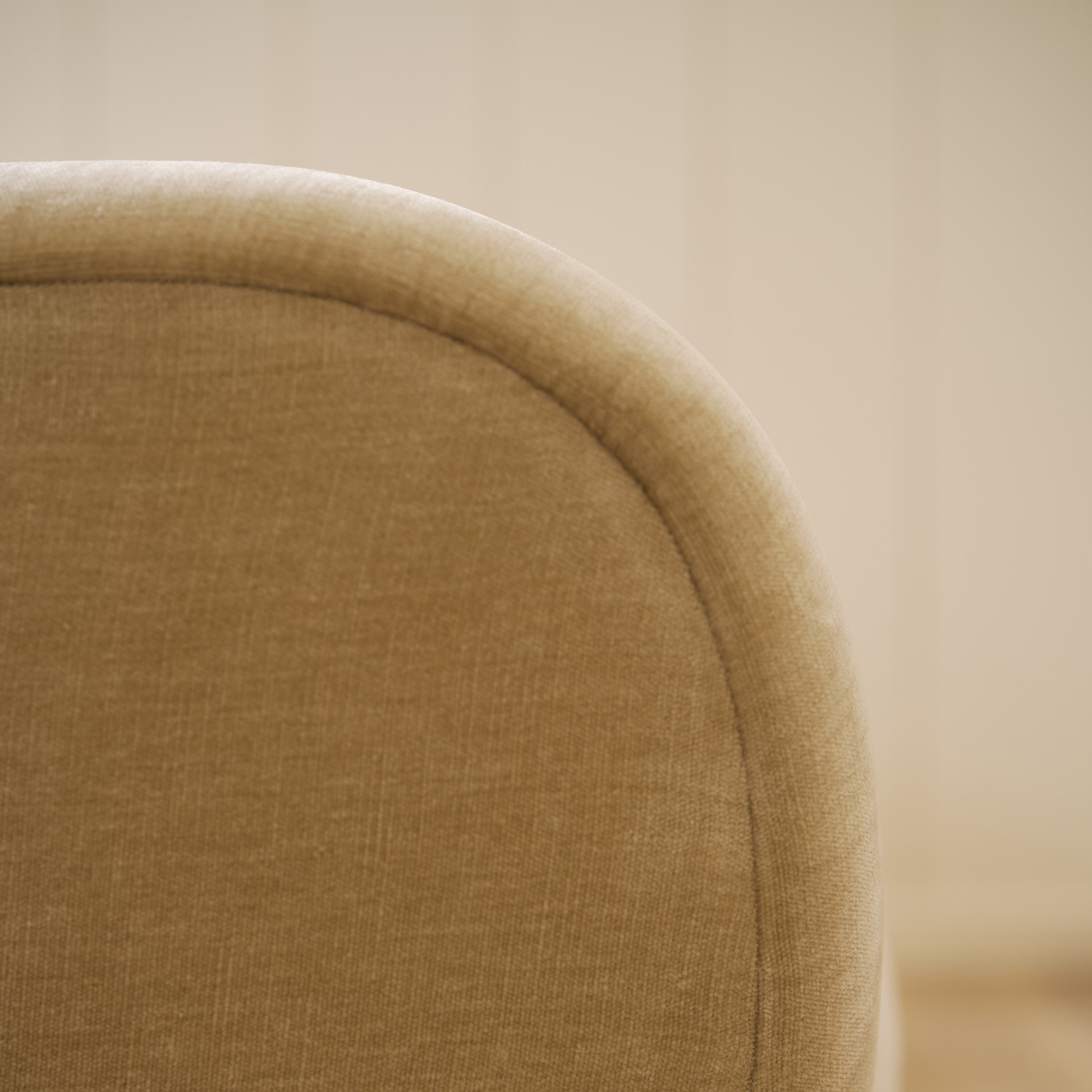 As shown upholstered in Canyon Sand, legs in Sand finish