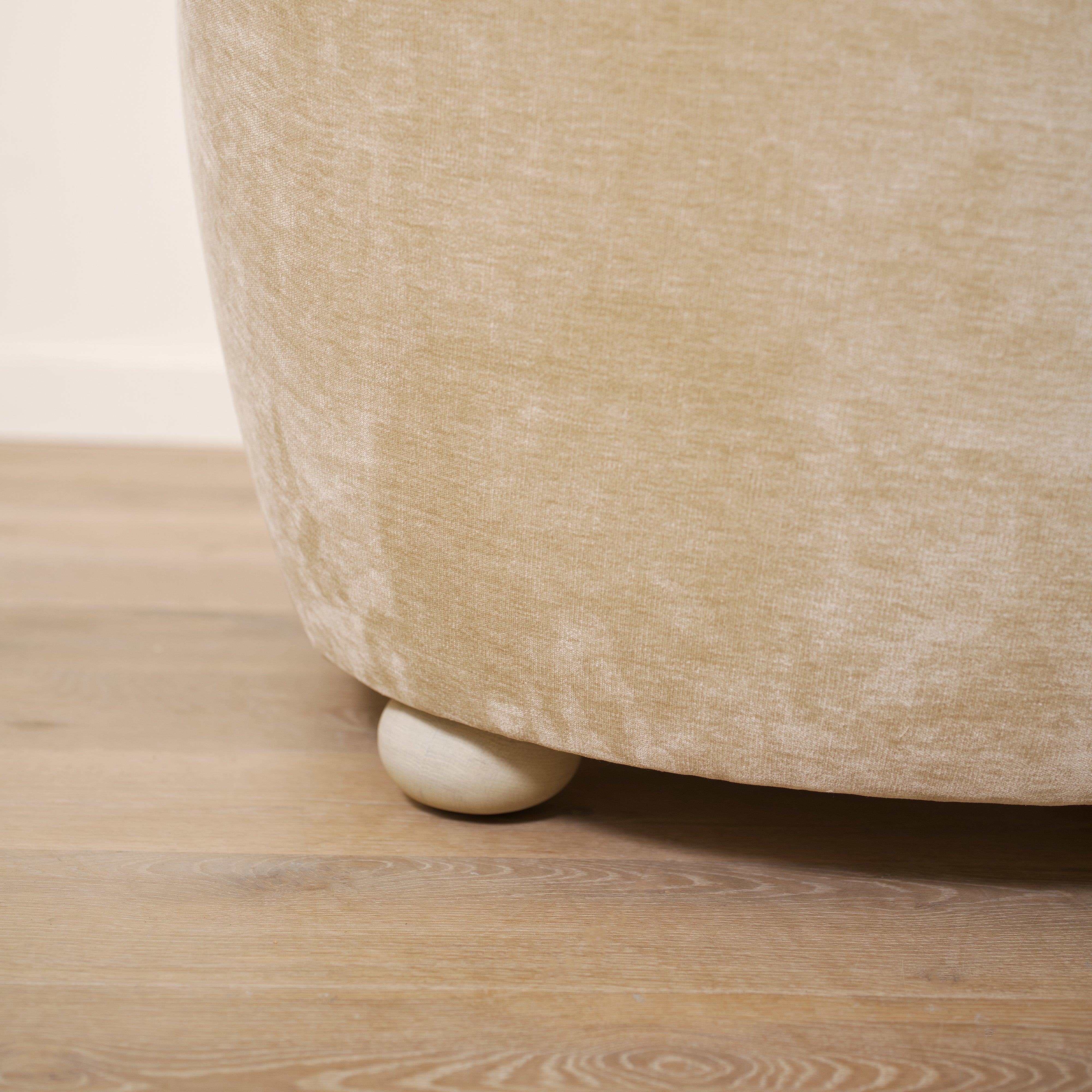 As shown upholstered in Canyon Sand, legs in Sand finish