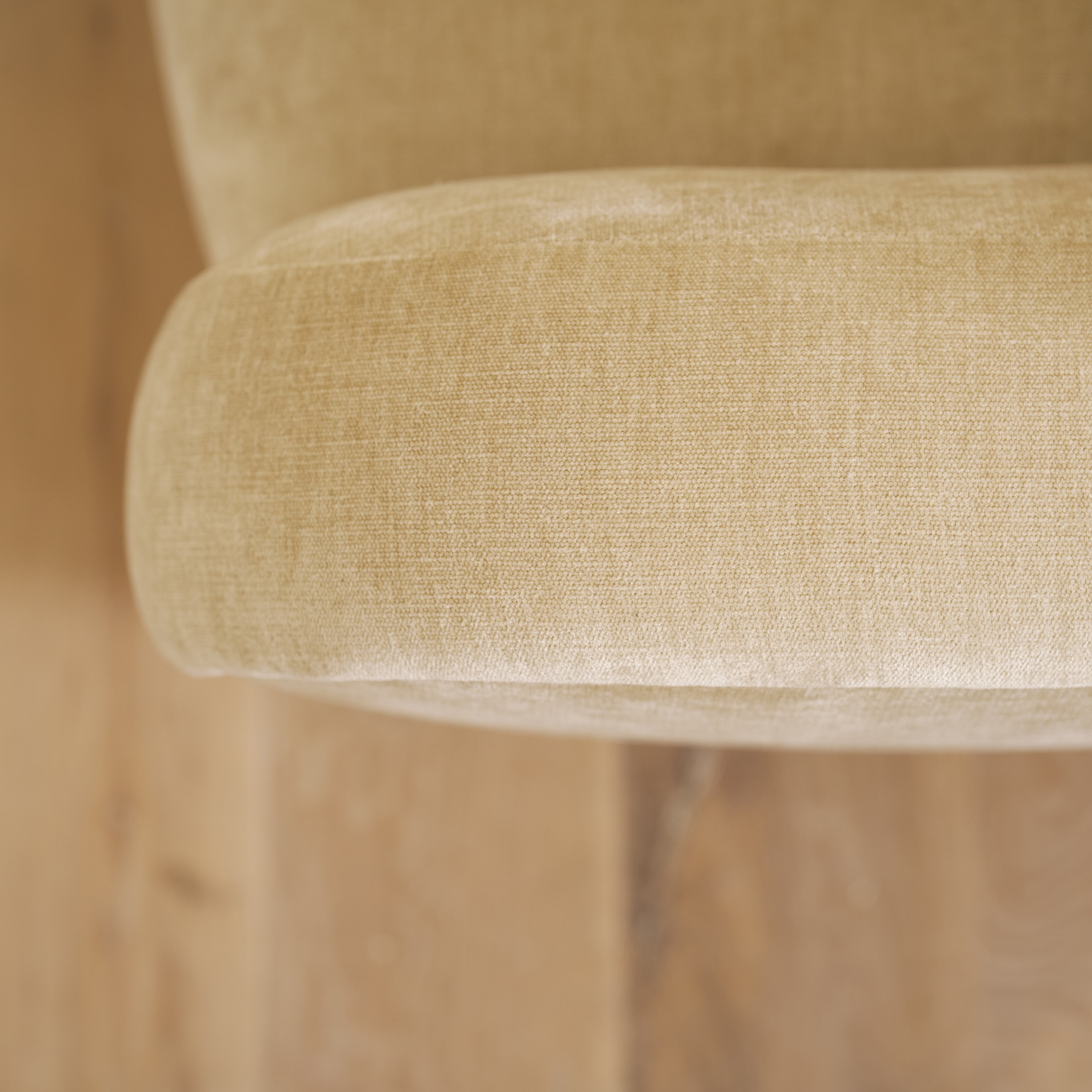 As shown upholstered in Canyon Sand, legs in Sand finish