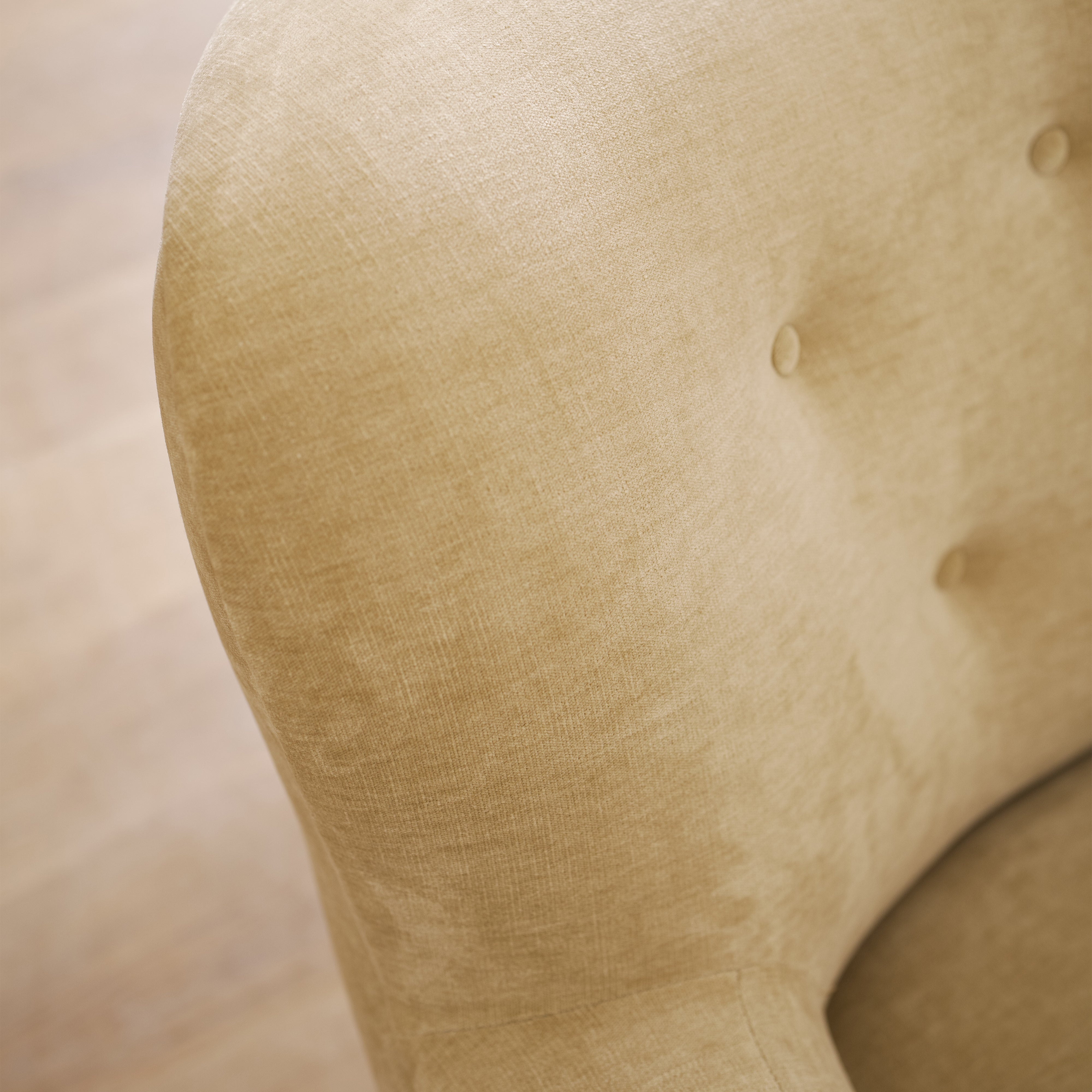 As shown upholstered in Canyon Sand, legs in Sand finish