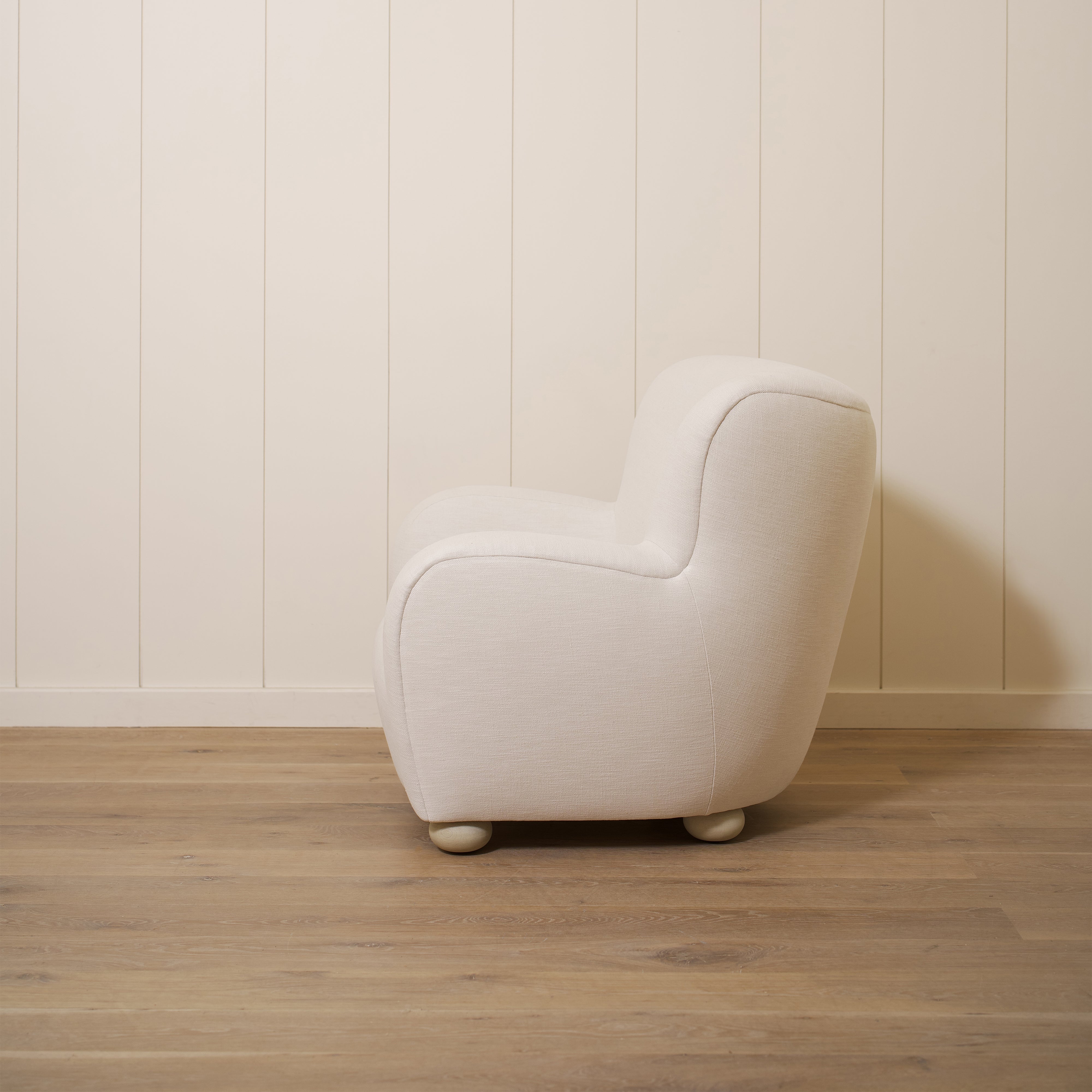 As shown upholstered in Vail Oyster, legs in Sand finish