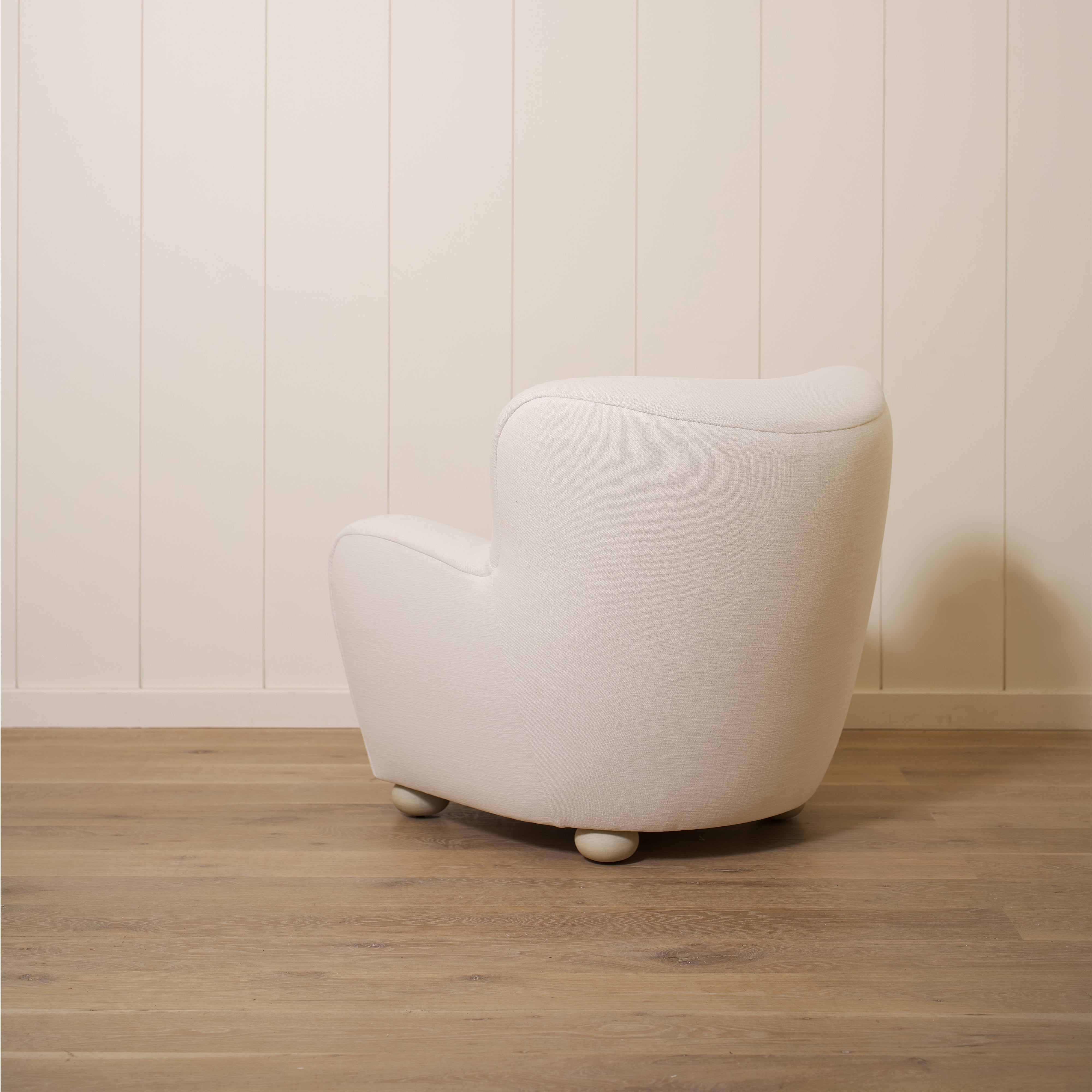 As shown upholstered in Vail Oyster, legs in Sand finish