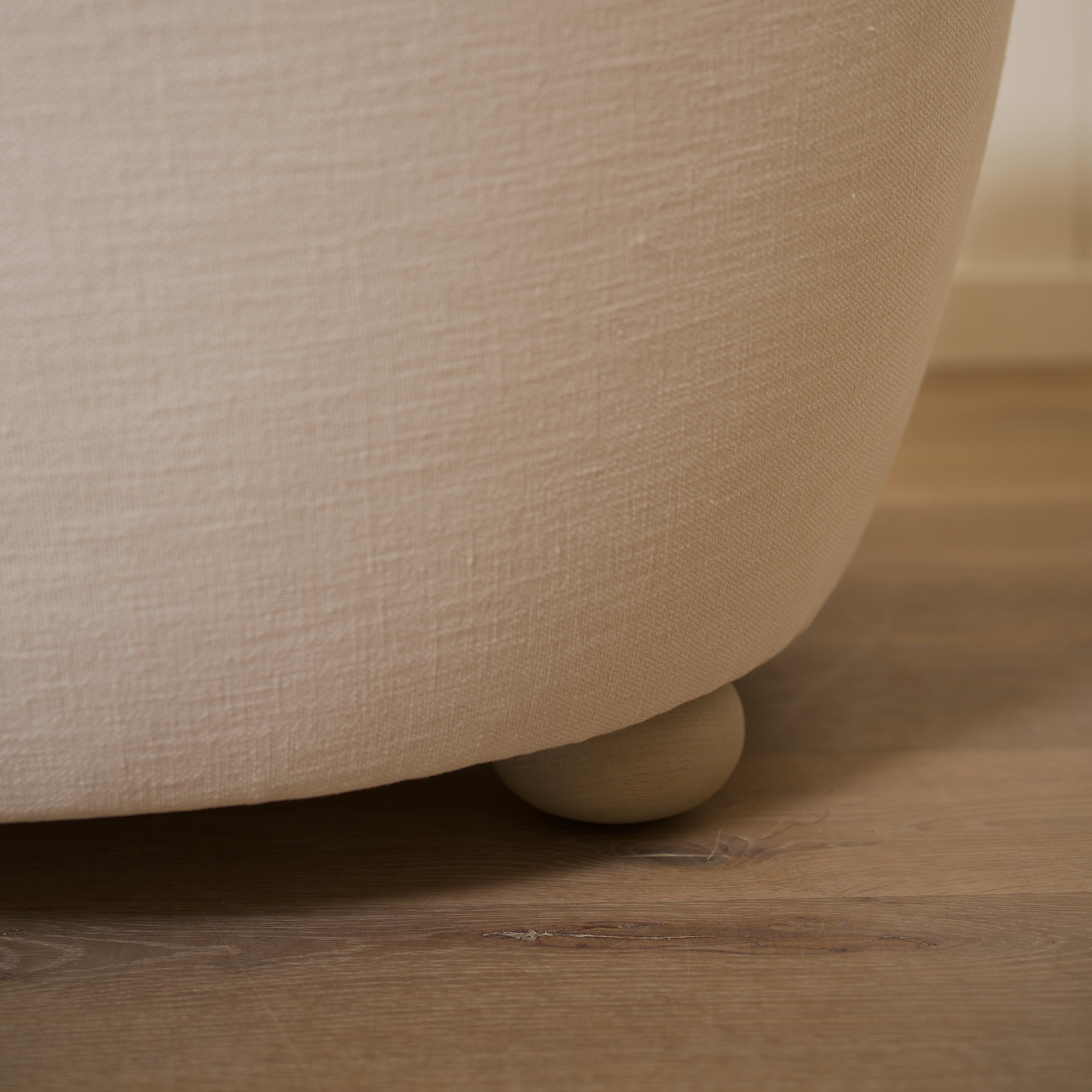 As shown upholstered in Vail Oyster, legs in Sand finish