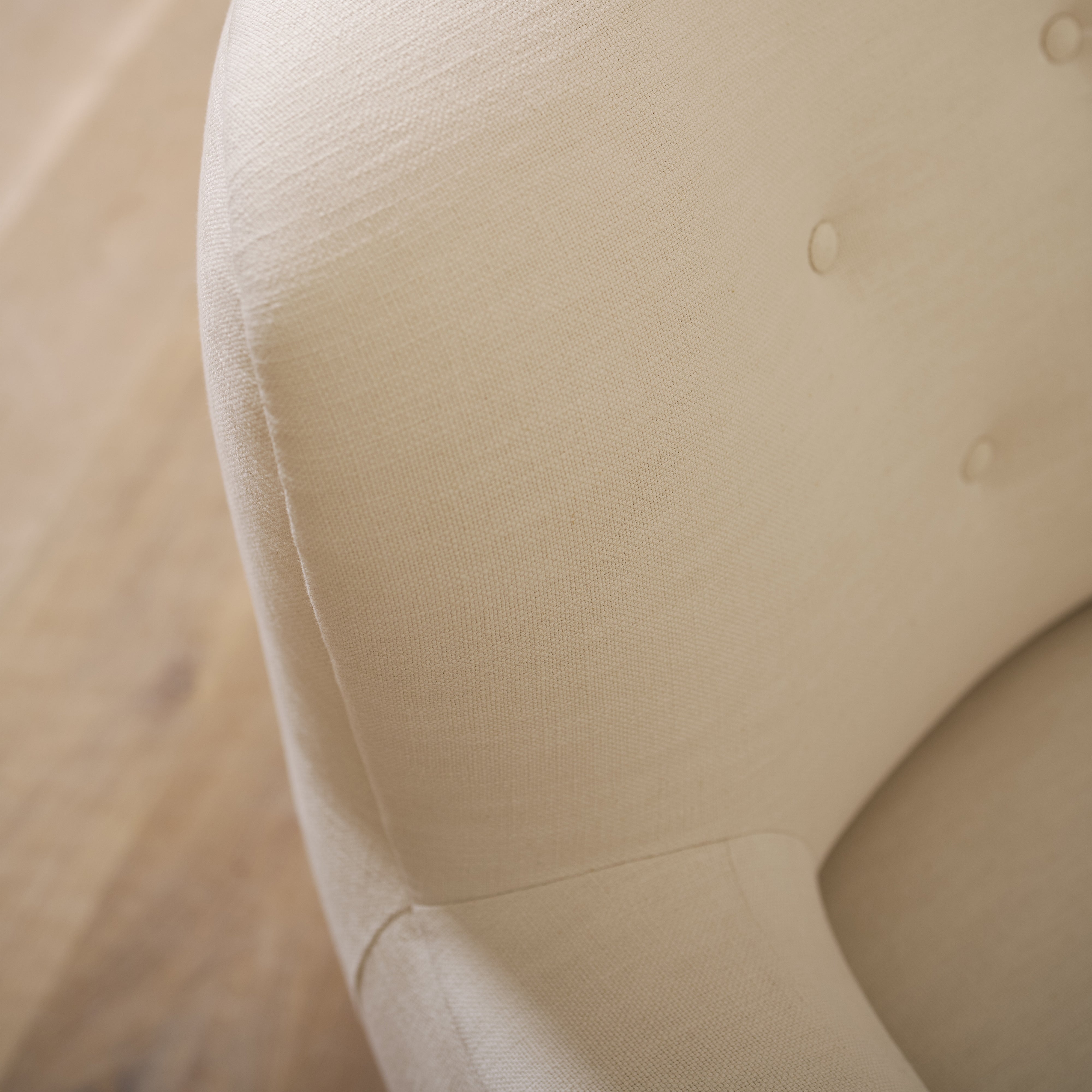 As shown upholstered in Vail Oyster, legs in Sand finish