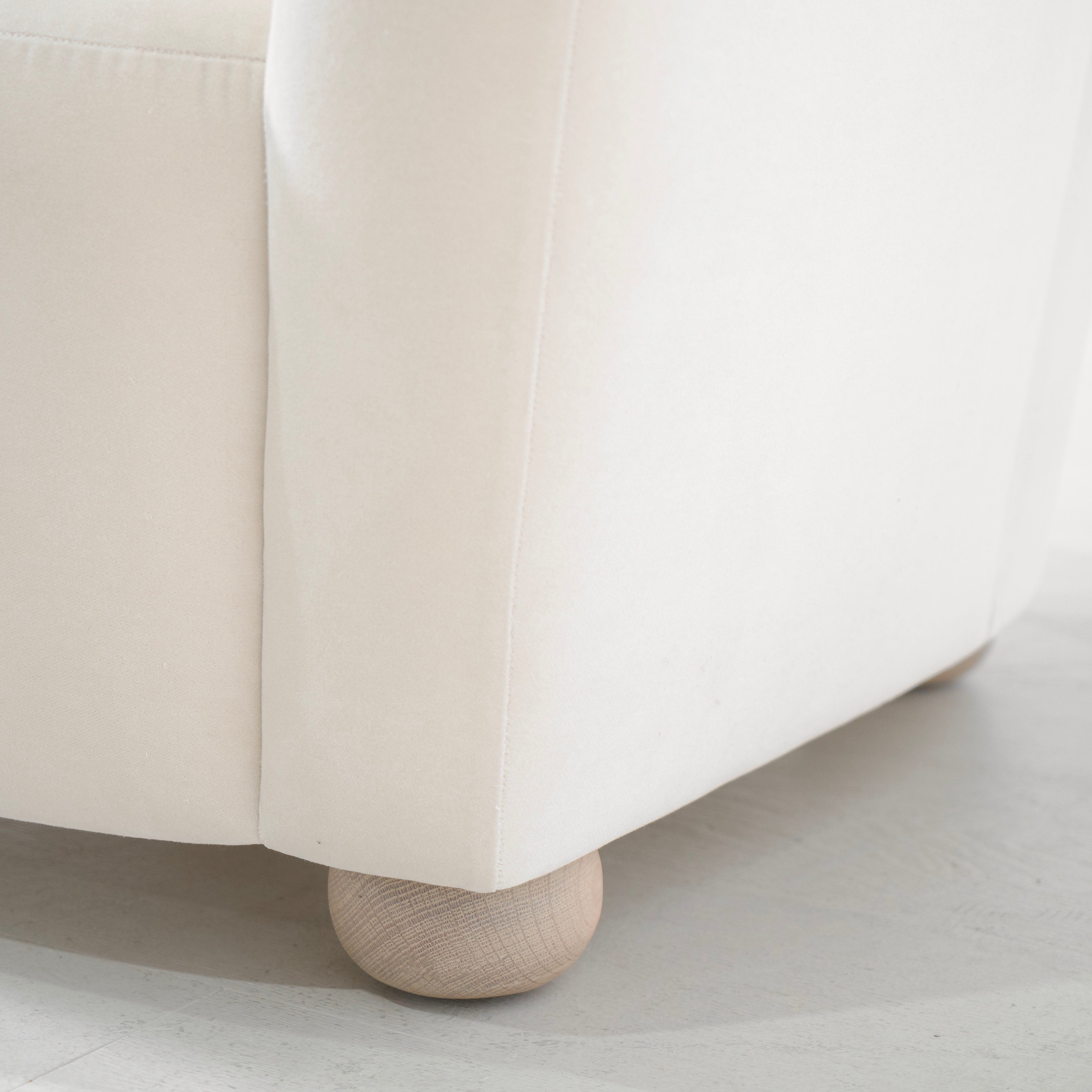 As Shown: in Sky Natural, oak legs finished in Mint White Natural.