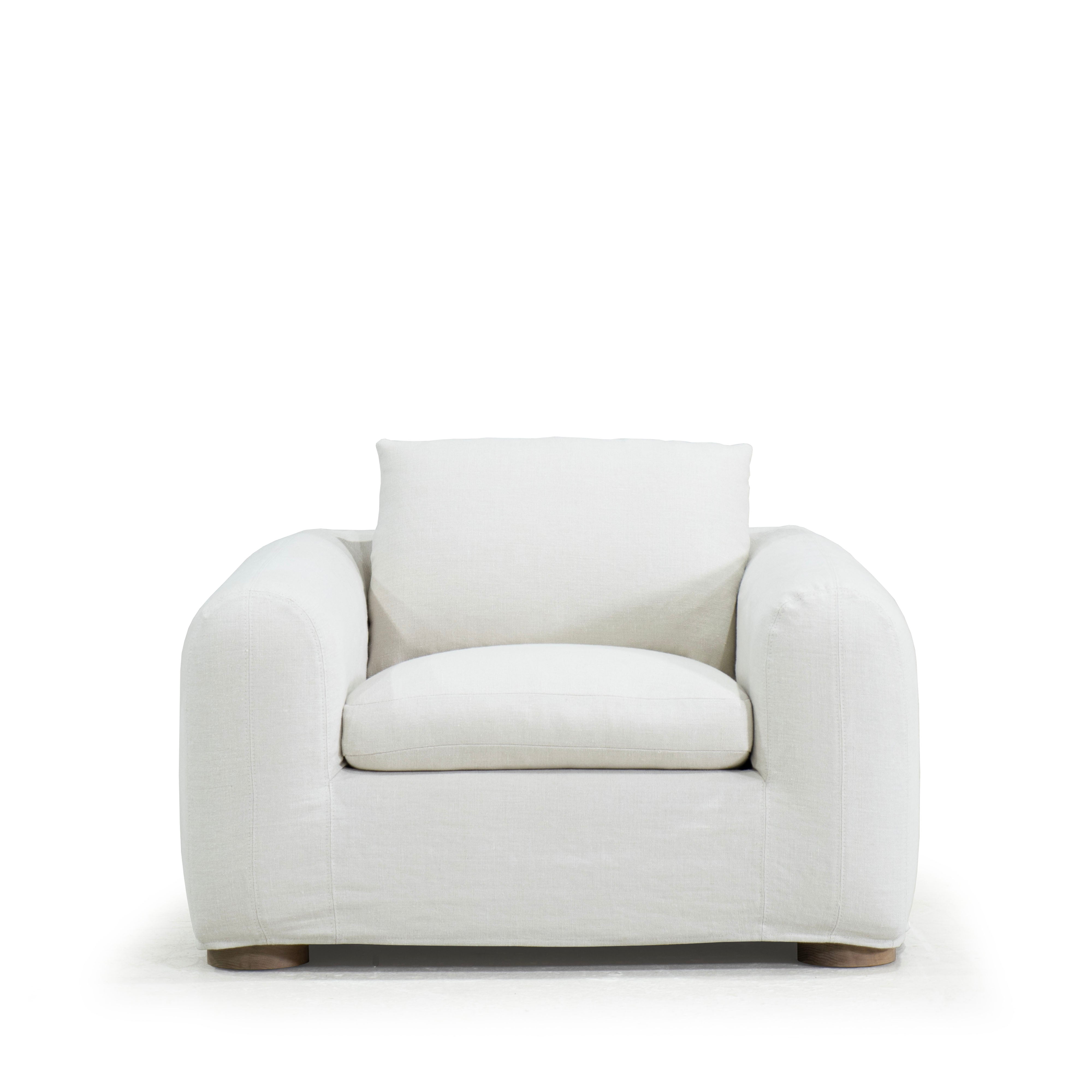 As Shown in Slipcovered Fresno Sand, Oak Round Legs finished in Cashmere Brown (Discontinued Finish)