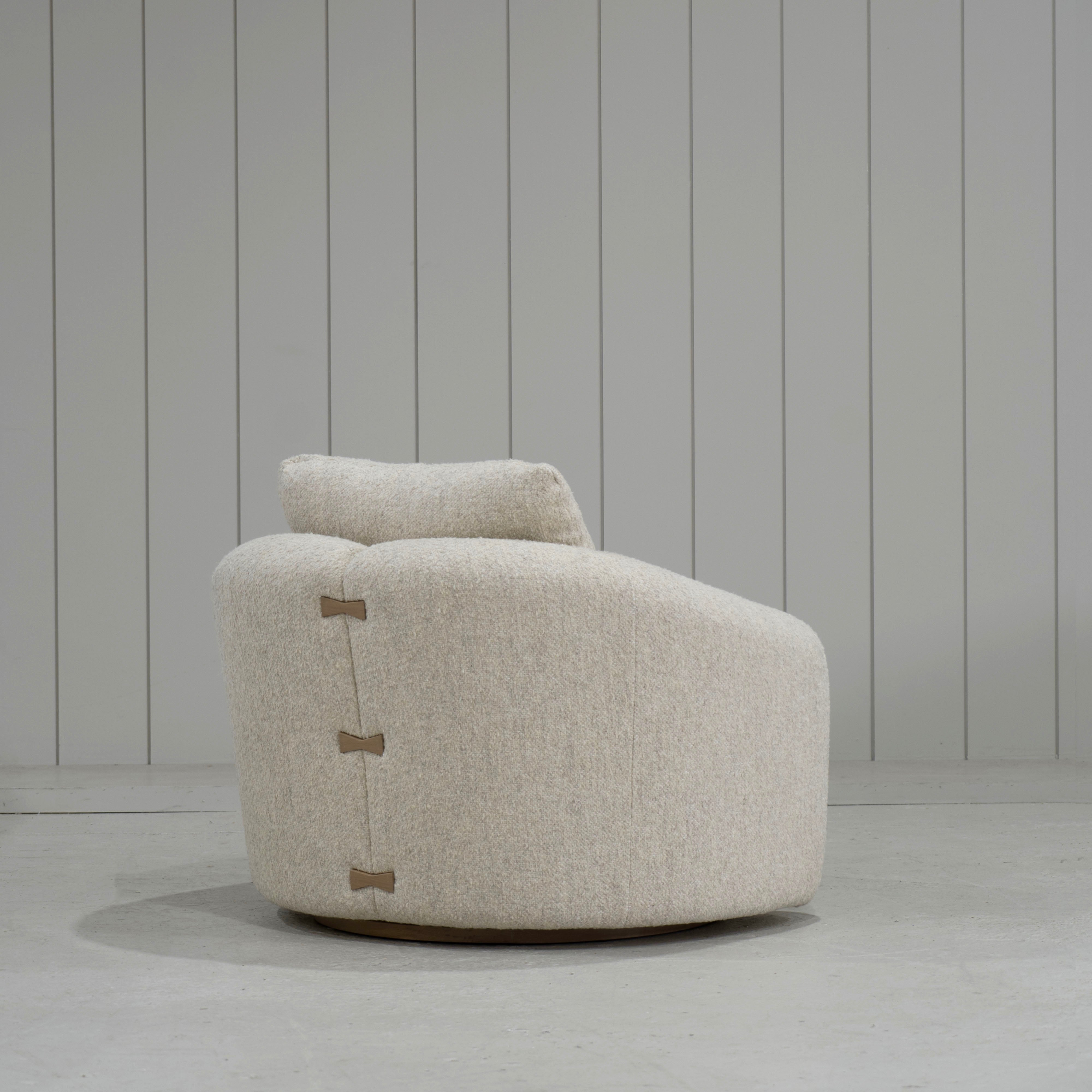 As Shown: in Berber Natural, swivel finished in Mint White Natural.