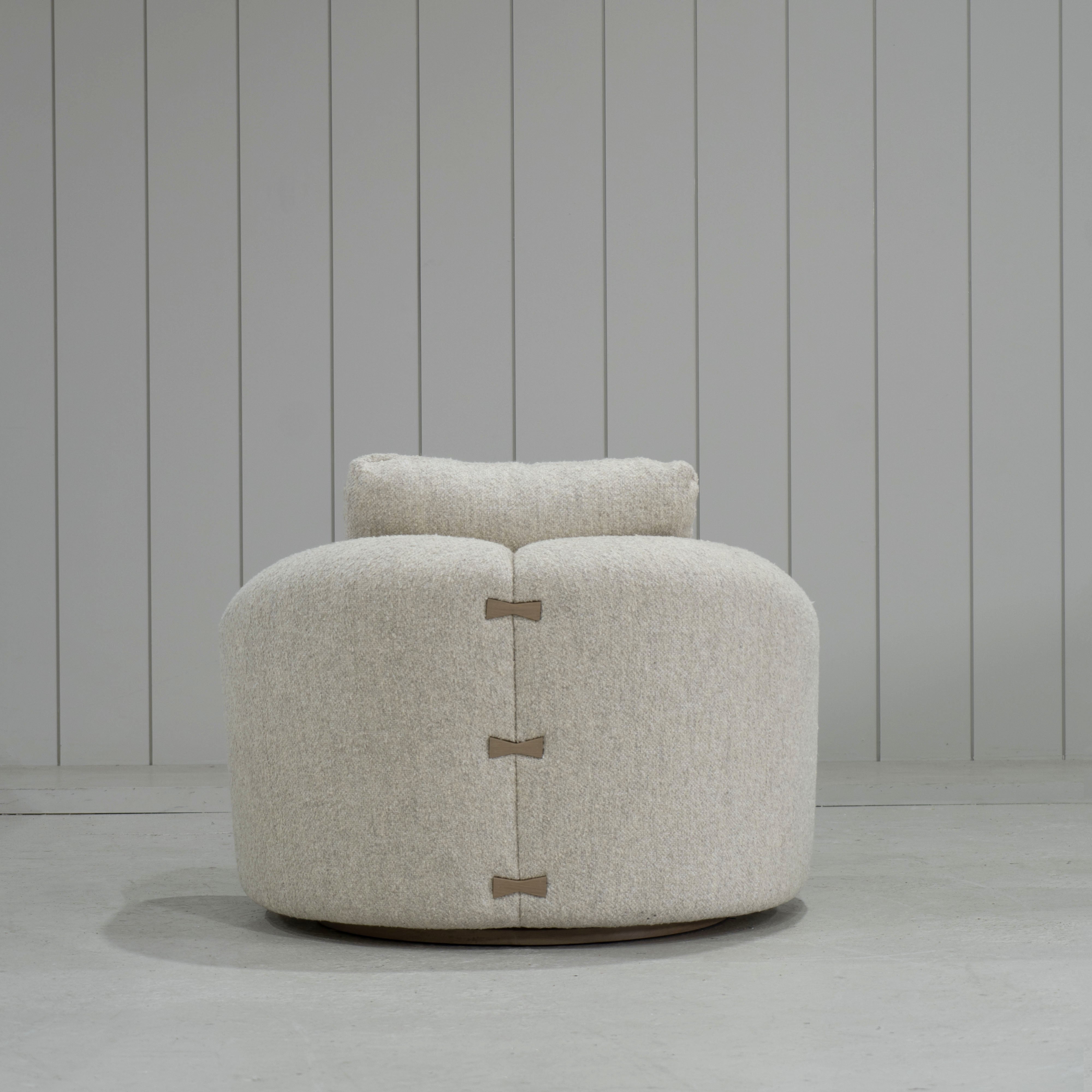 As Shown: in Berber Natural, swivel finished in Mint White Natural.
