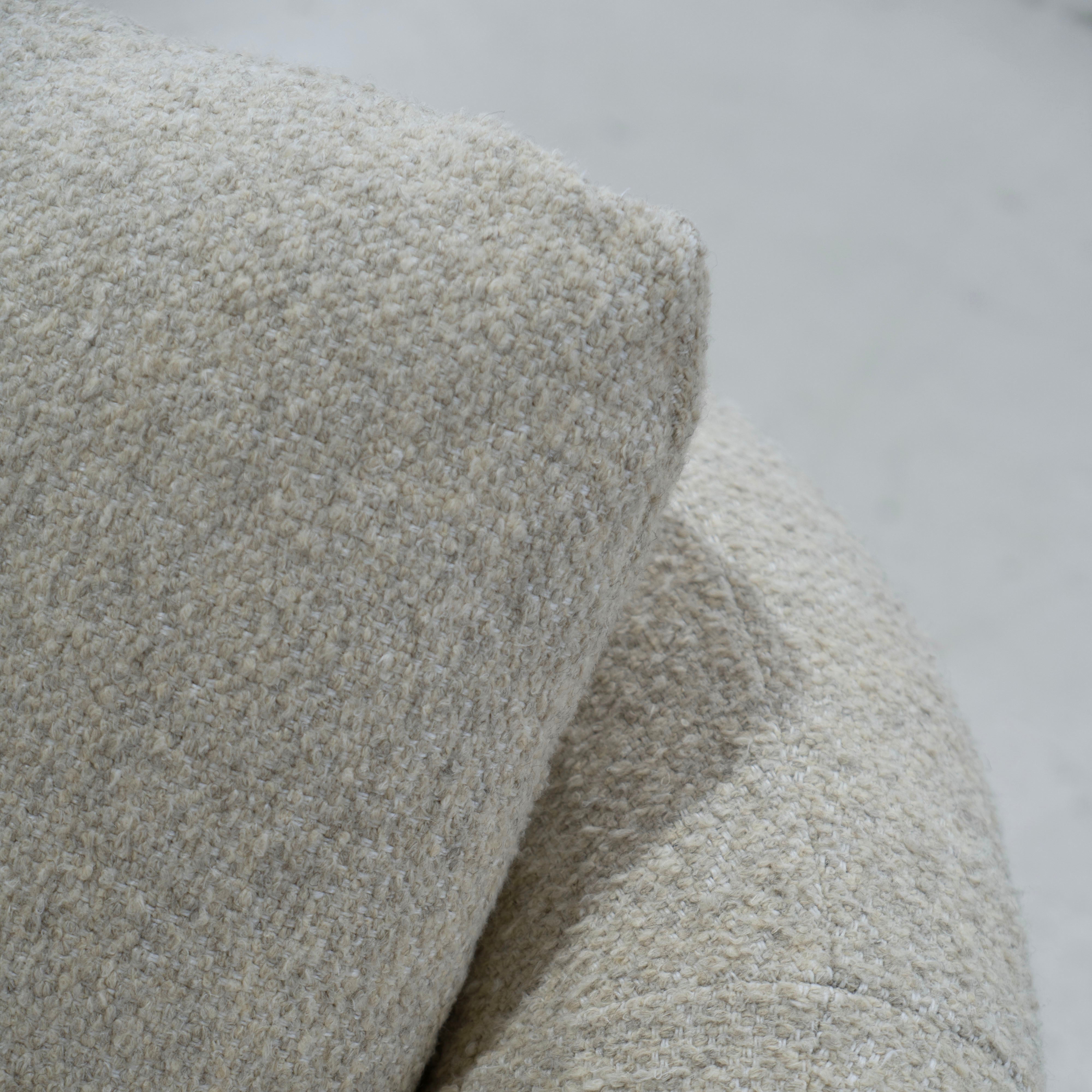 As Shown: in Berber Natural, swivel finished in Mint White Natural.