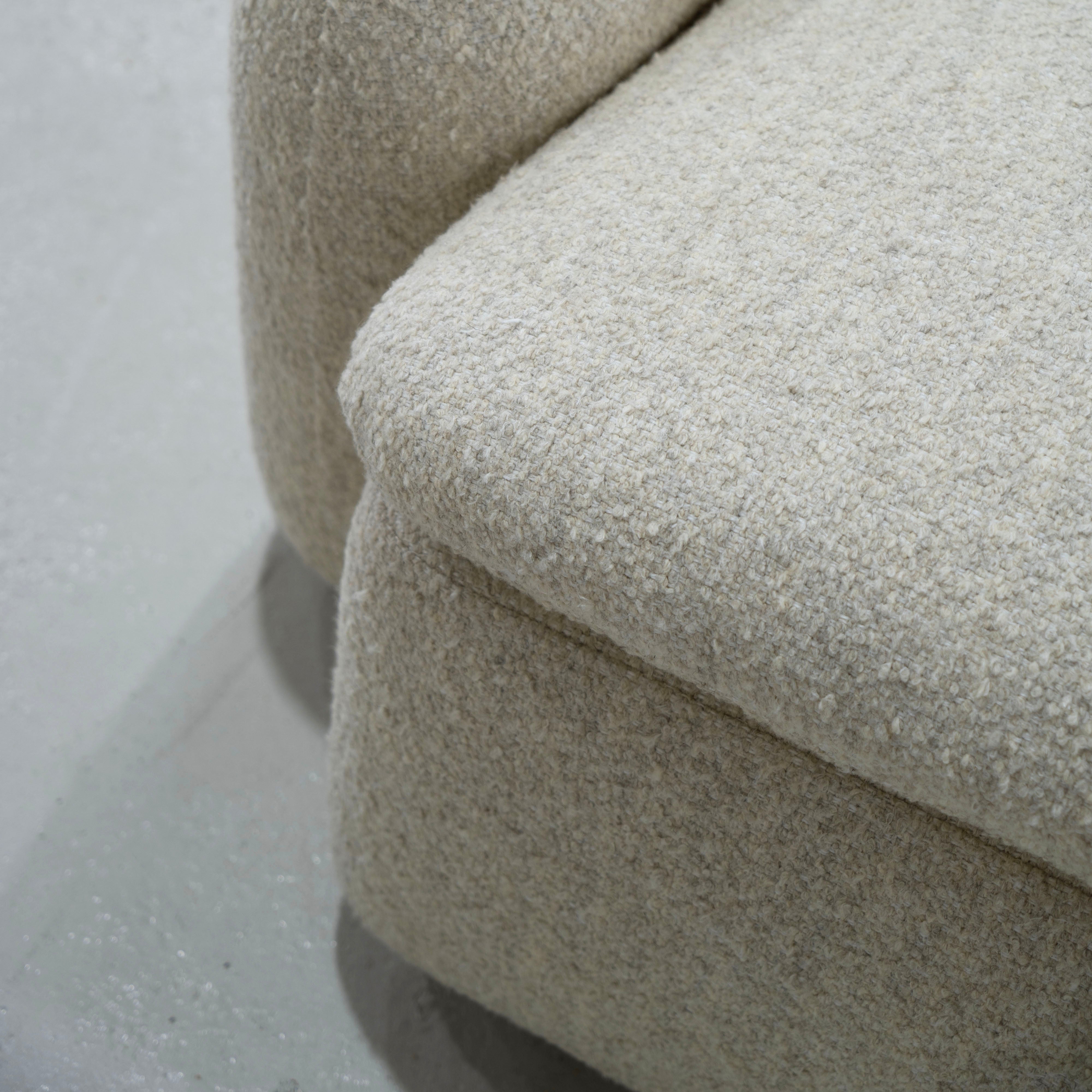 As Shown: in Berber Natural, swivel finished in Mint White Natural.