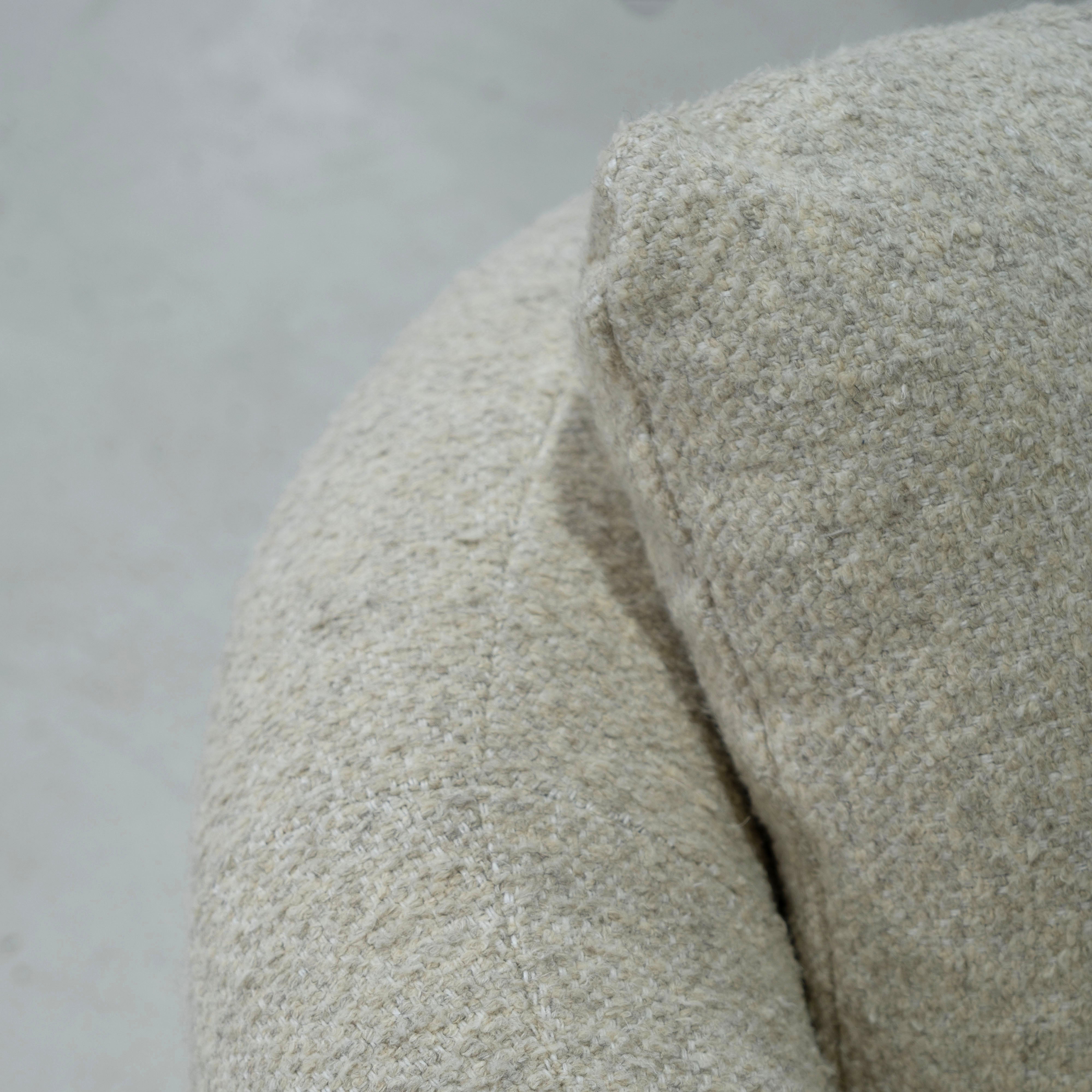 As Shown: in Berber Natural, swivel finished in Mint White Natural.