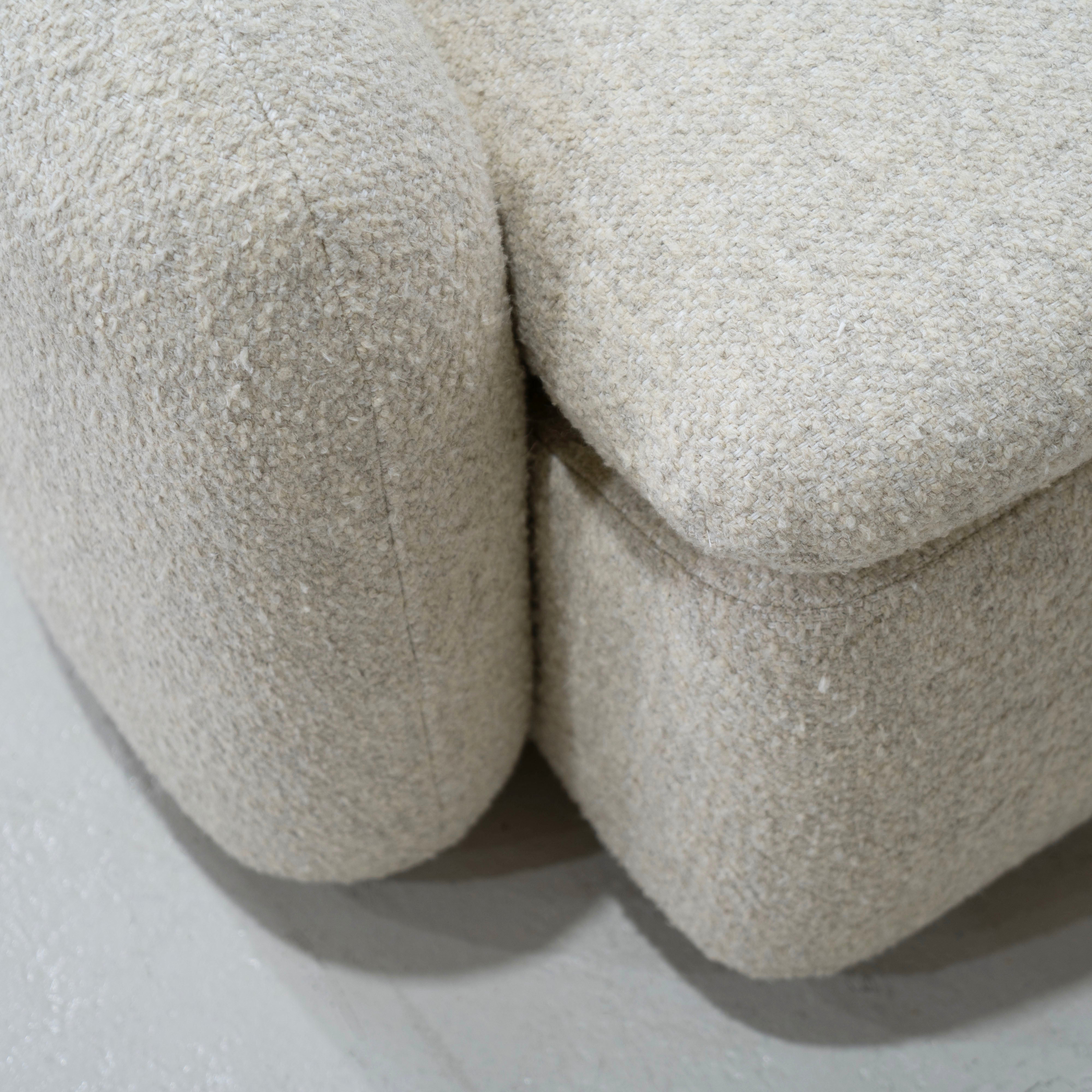 As Shown: in Berber Natural, swivel finished in Mint White Natural.