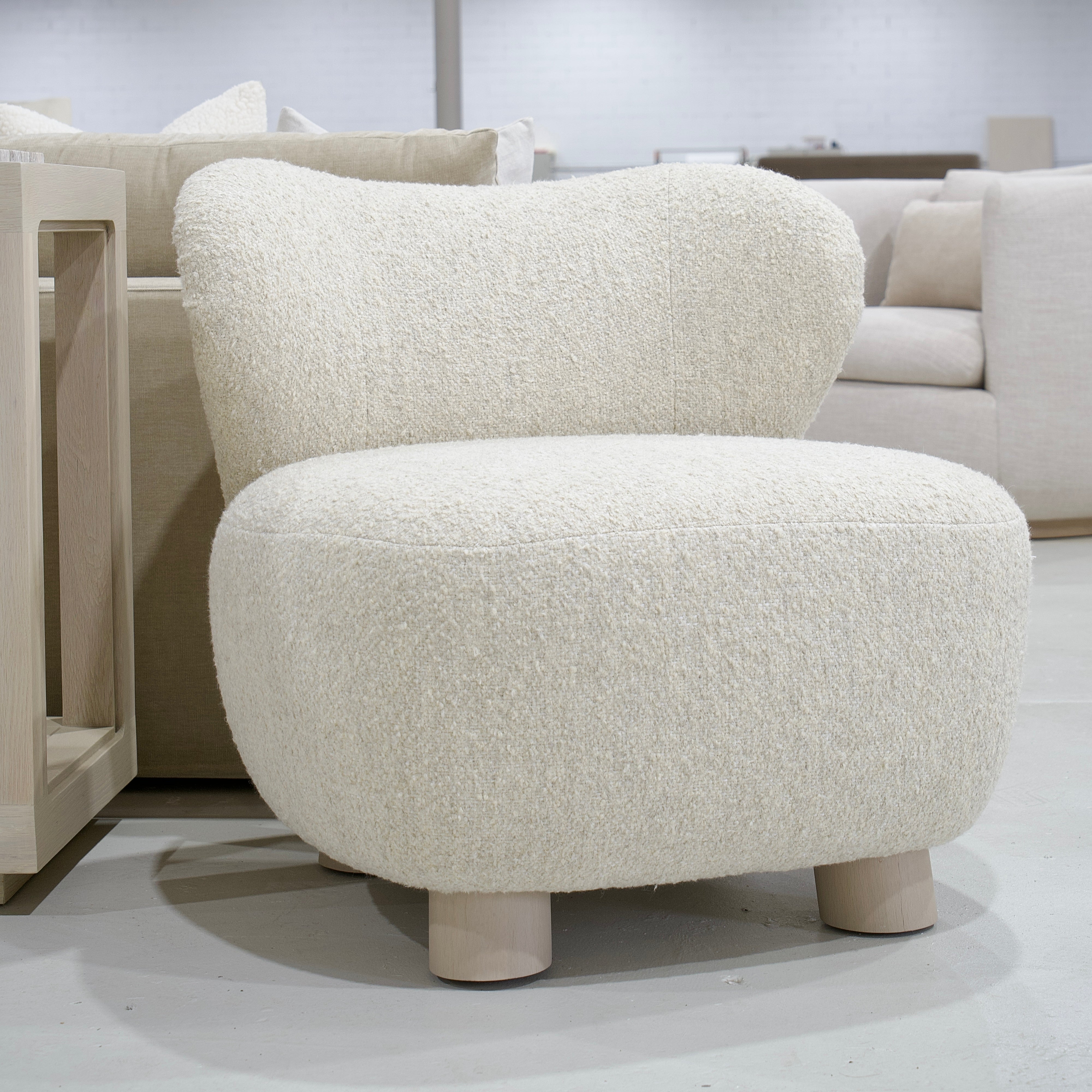 As Shown: 34"L x 35"D x 32"H | Style: Upholstered | Fabric: Berber Natural | Base: Legs | Finish: Sand
