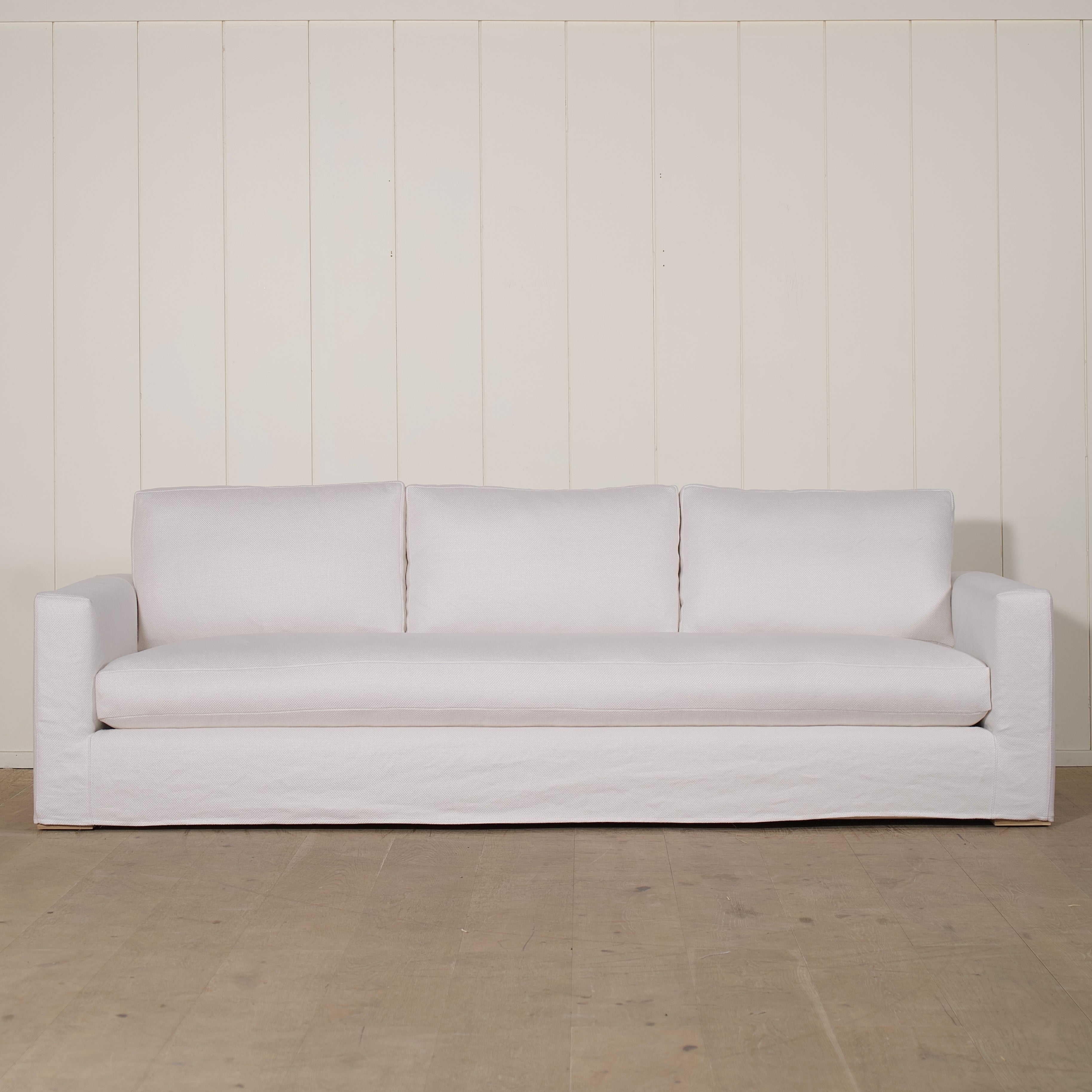 As Shown: slipcovered in COM fabric (Monte White), oak legs finished in Mint White Natural.