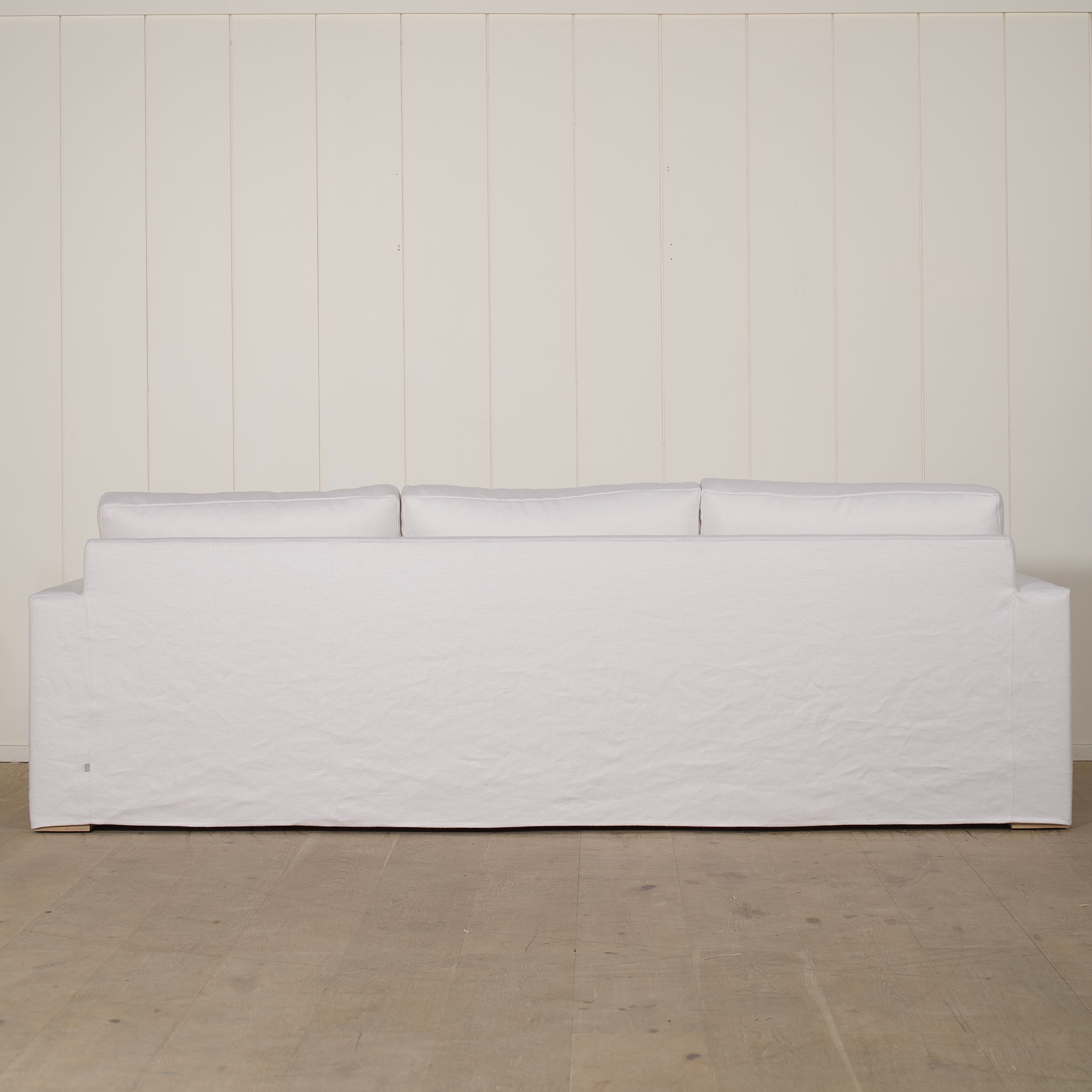 As Shown: slipcovered in COM fabric (Monte White), oak legs finished in Mint White Natural.