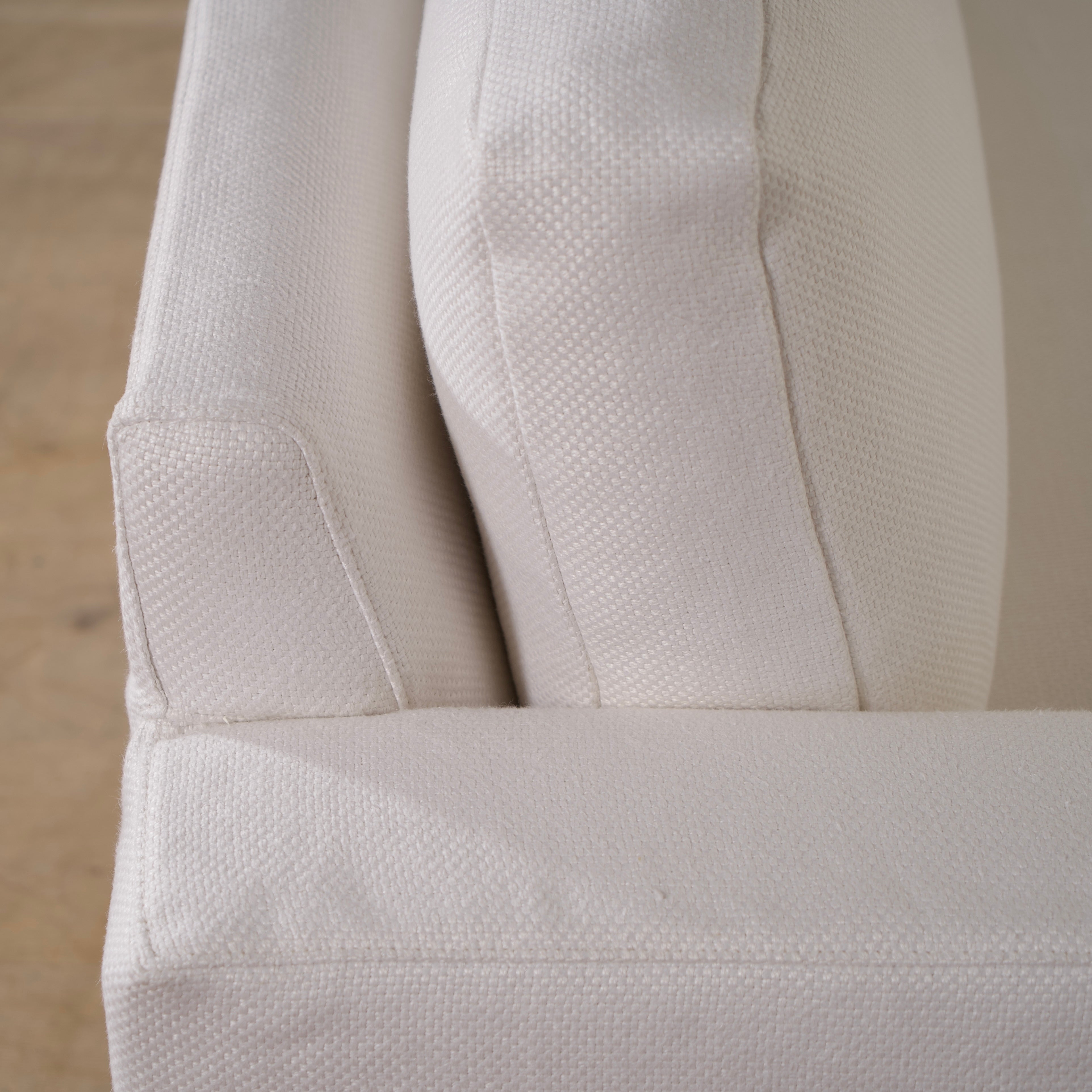 As Shown: slipcovered in COM fabric (Monte White), oak legs finished in Mint White Natural.