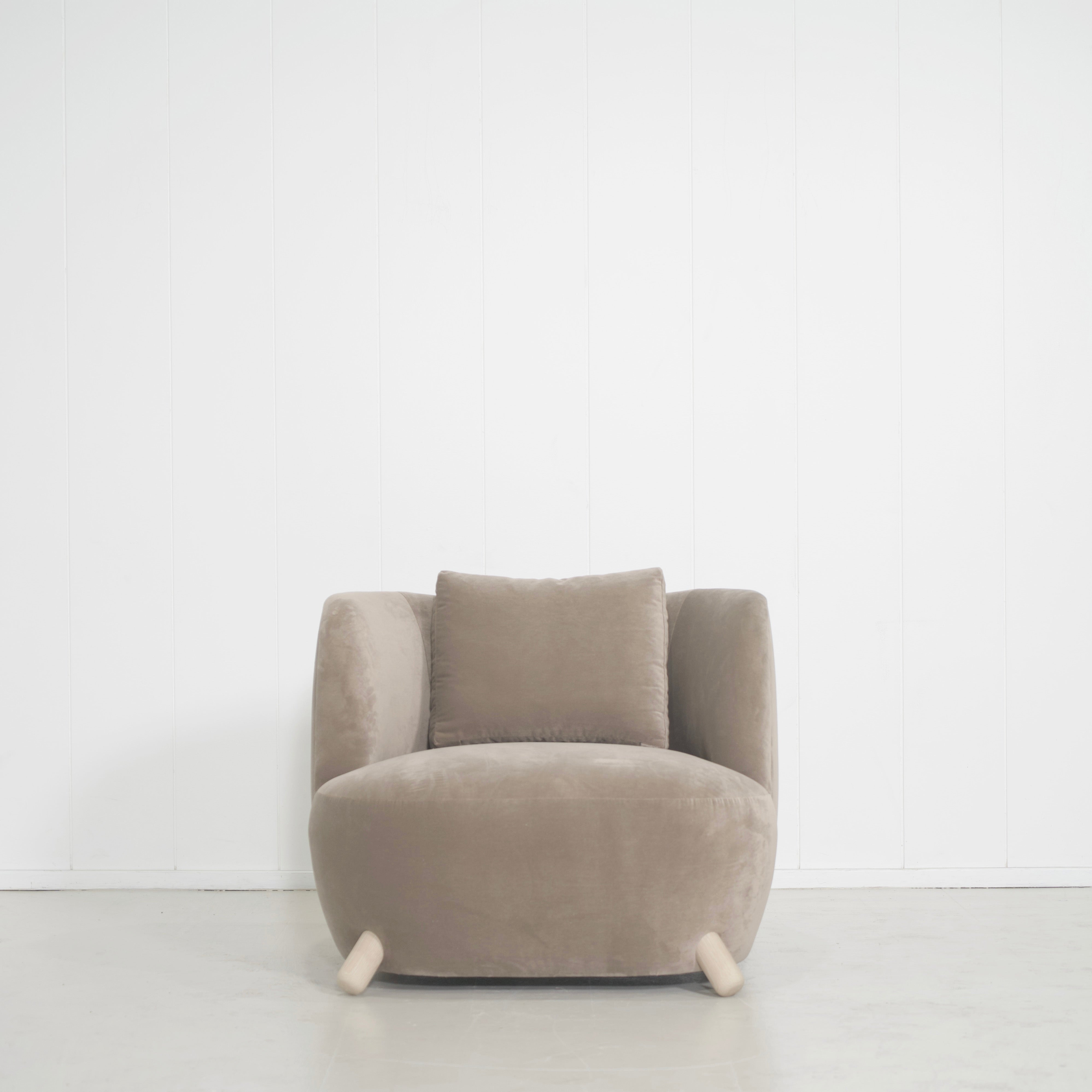 As Shown: in Sky Taupe with oak legs stained in Mint White Natural.