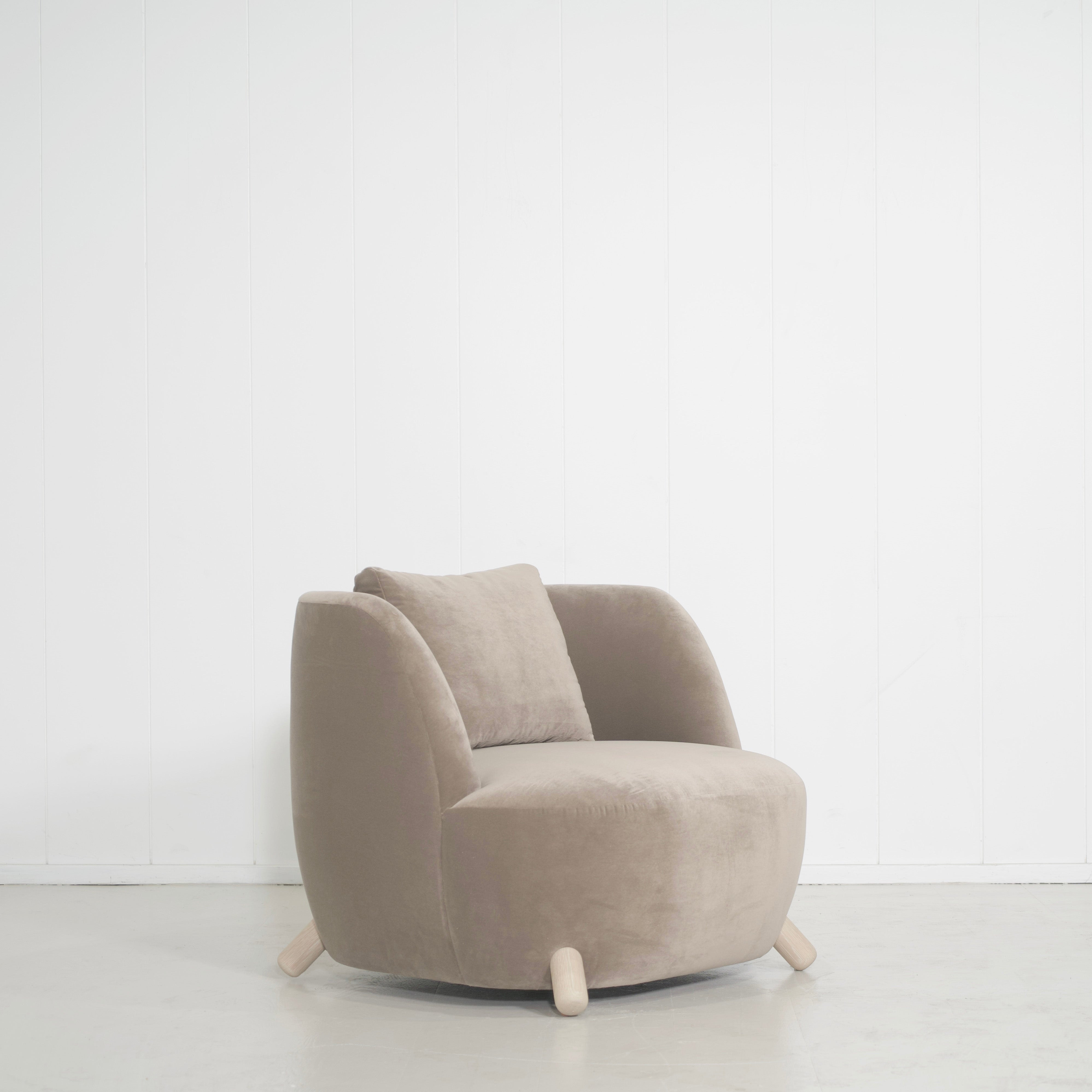 As Shown: in Sky Taupe with oak legs stained in Sand.