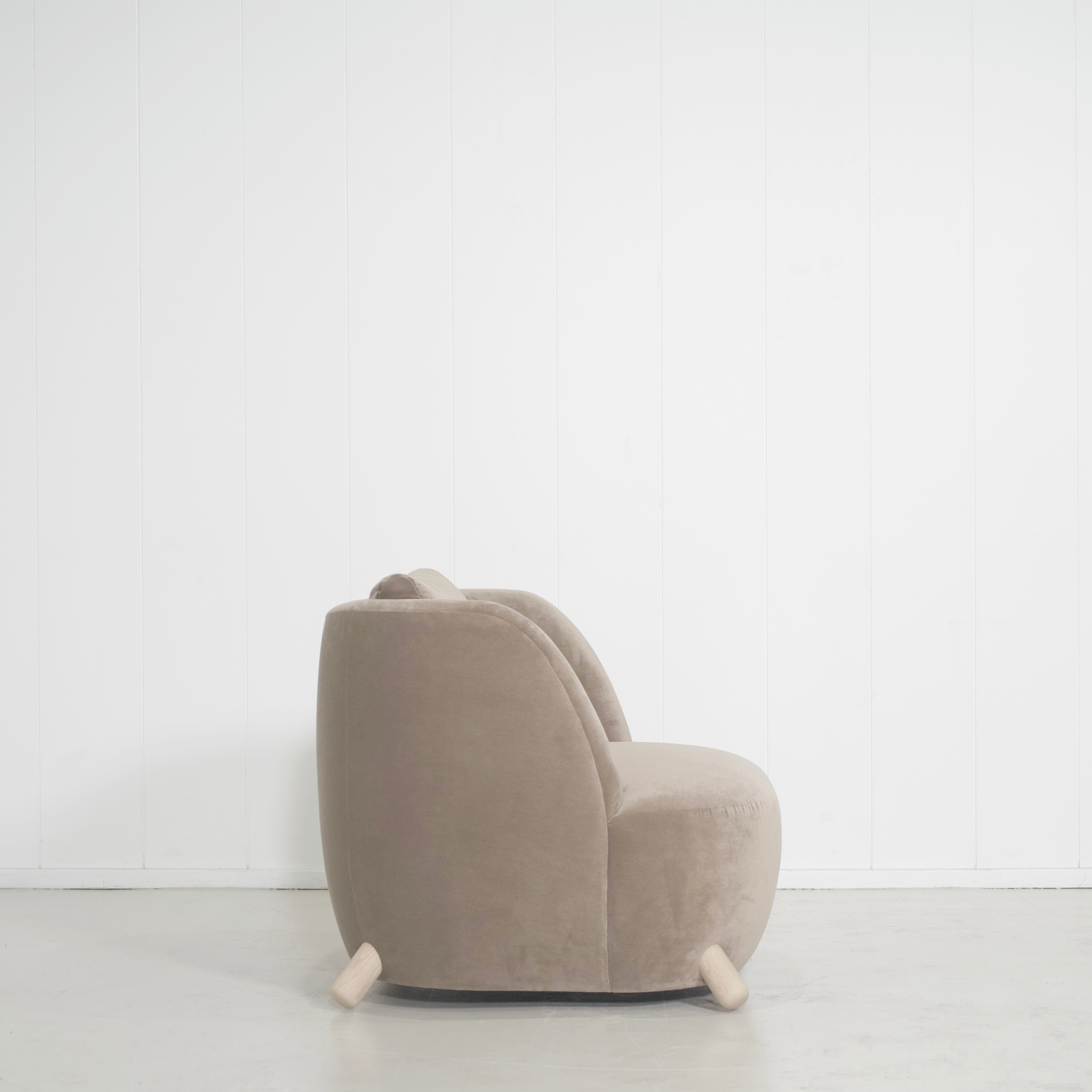 As Shown: in Sky Taupe with oak legs stained in Sand.