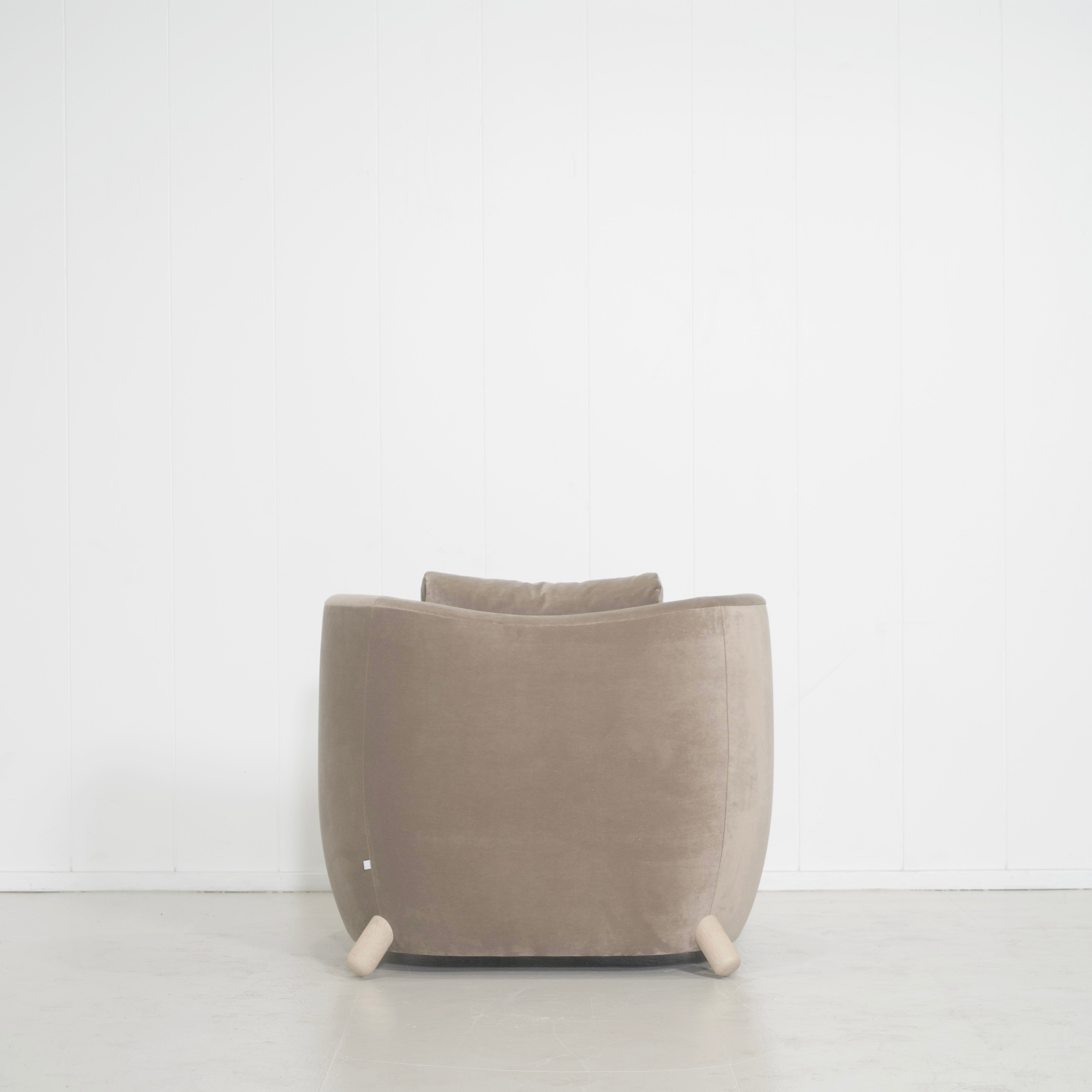 As Shown: in Sky Taupe with oak legs stained in Sand.