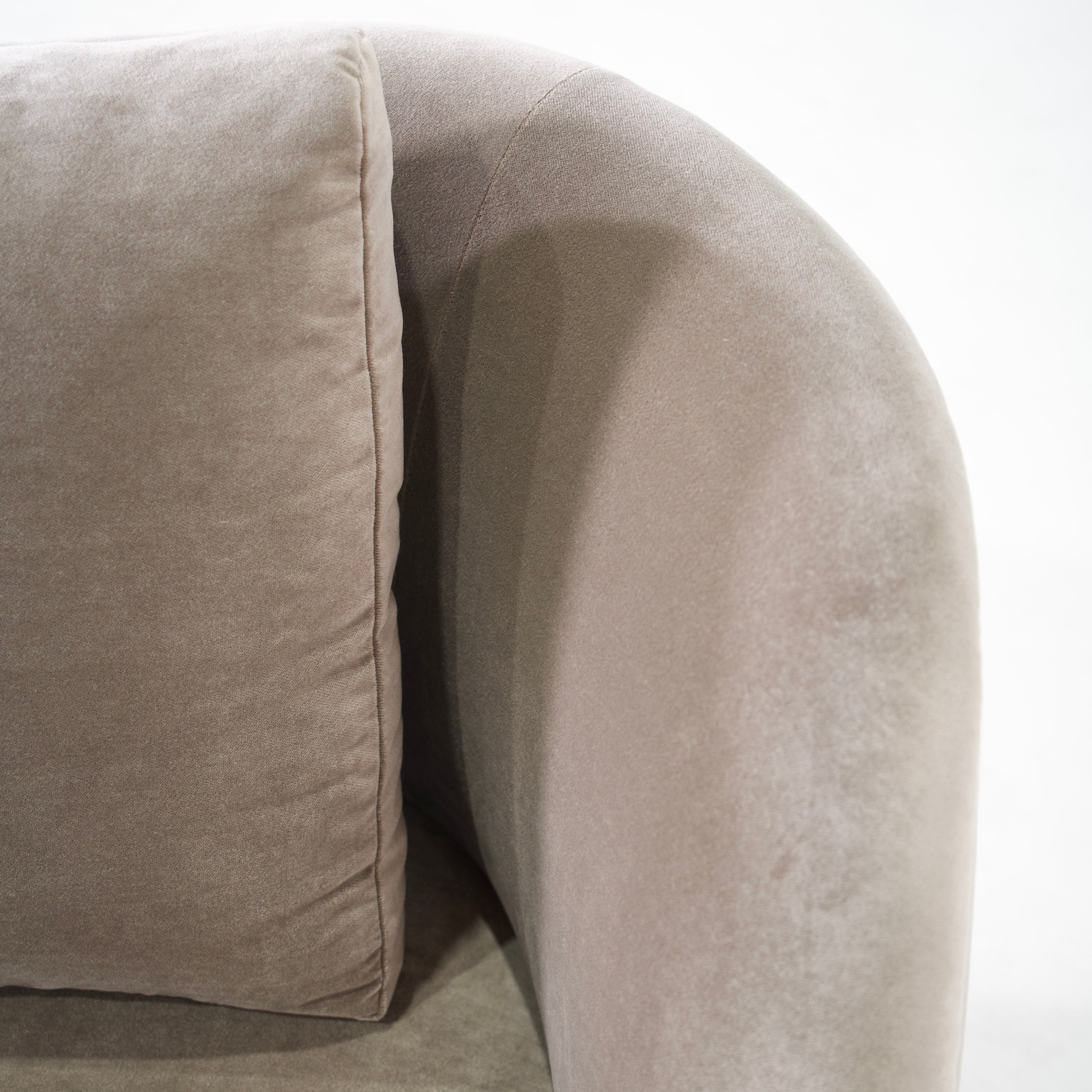 As Shown: in Sky Taupe with oak legs stained in Sand.