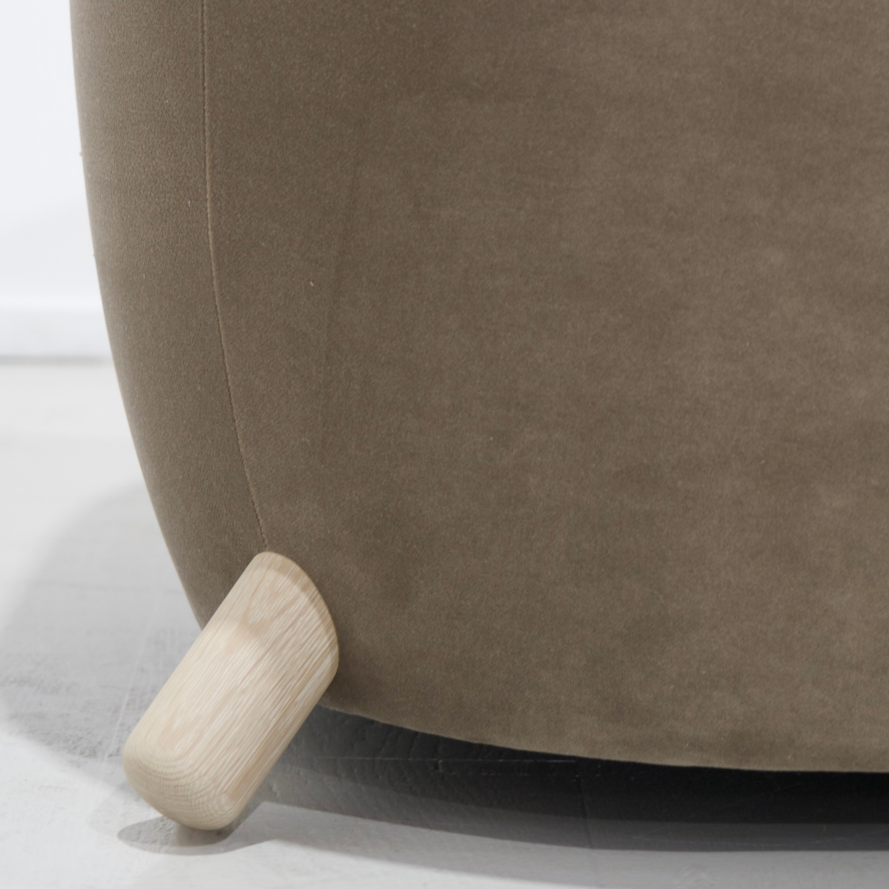 As Shown: in Sky Taupe with oak legs stained in Sand.