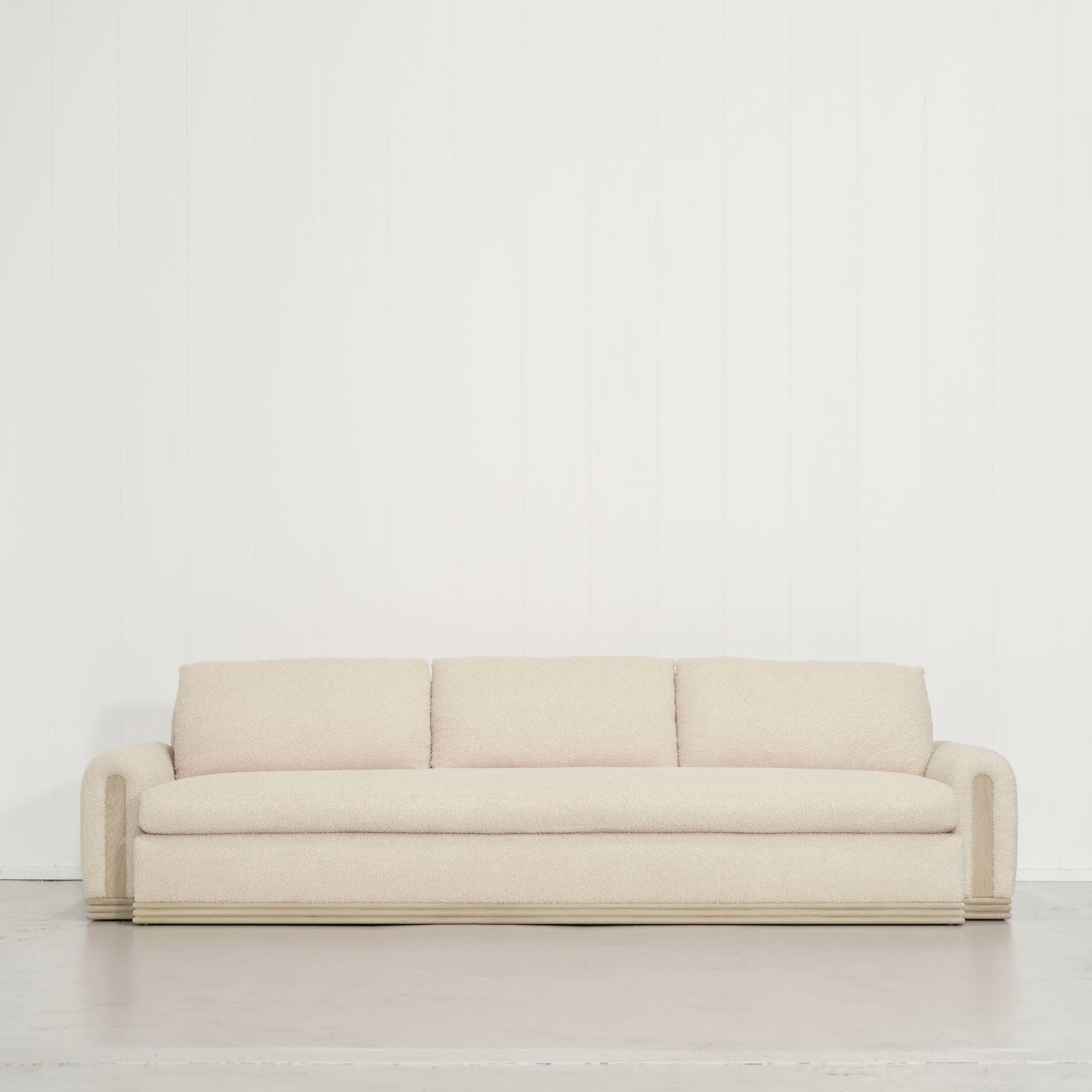 As Shown: 135"W x 42"D x 33"H | Style: Upholstered | Fabric: Teddy Ivory | Finish: Natural