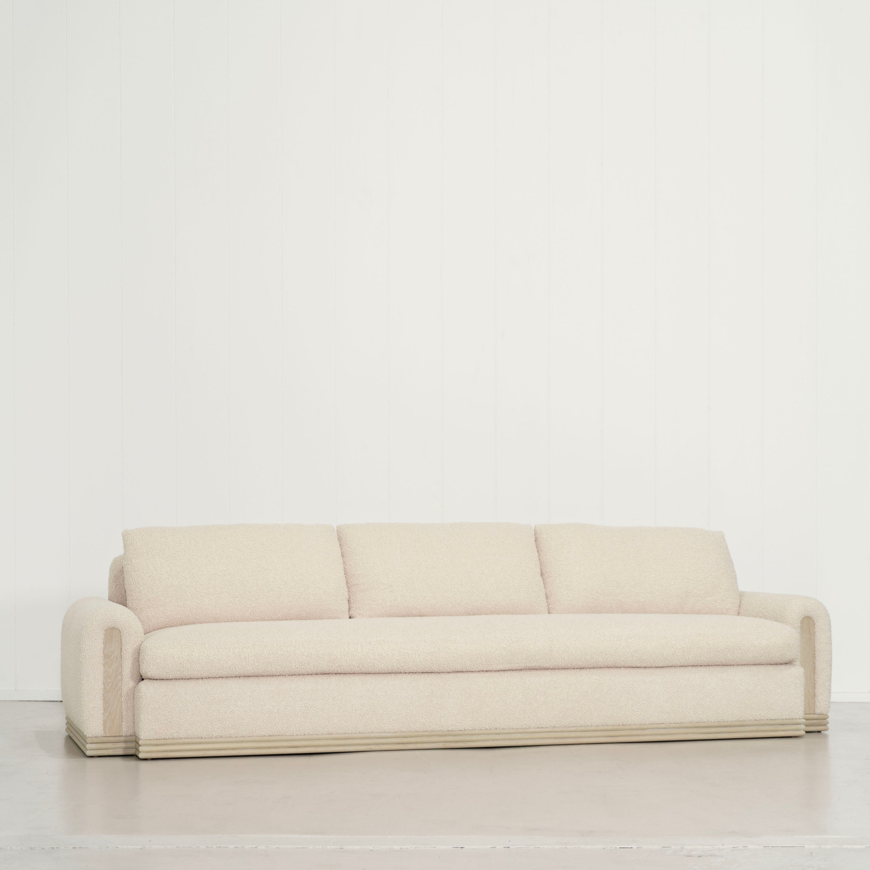 As Shown: 135"W x 42"D x 33"H | Style: Upholstered | Fabric: Teddy Ivory | Finish: Natural