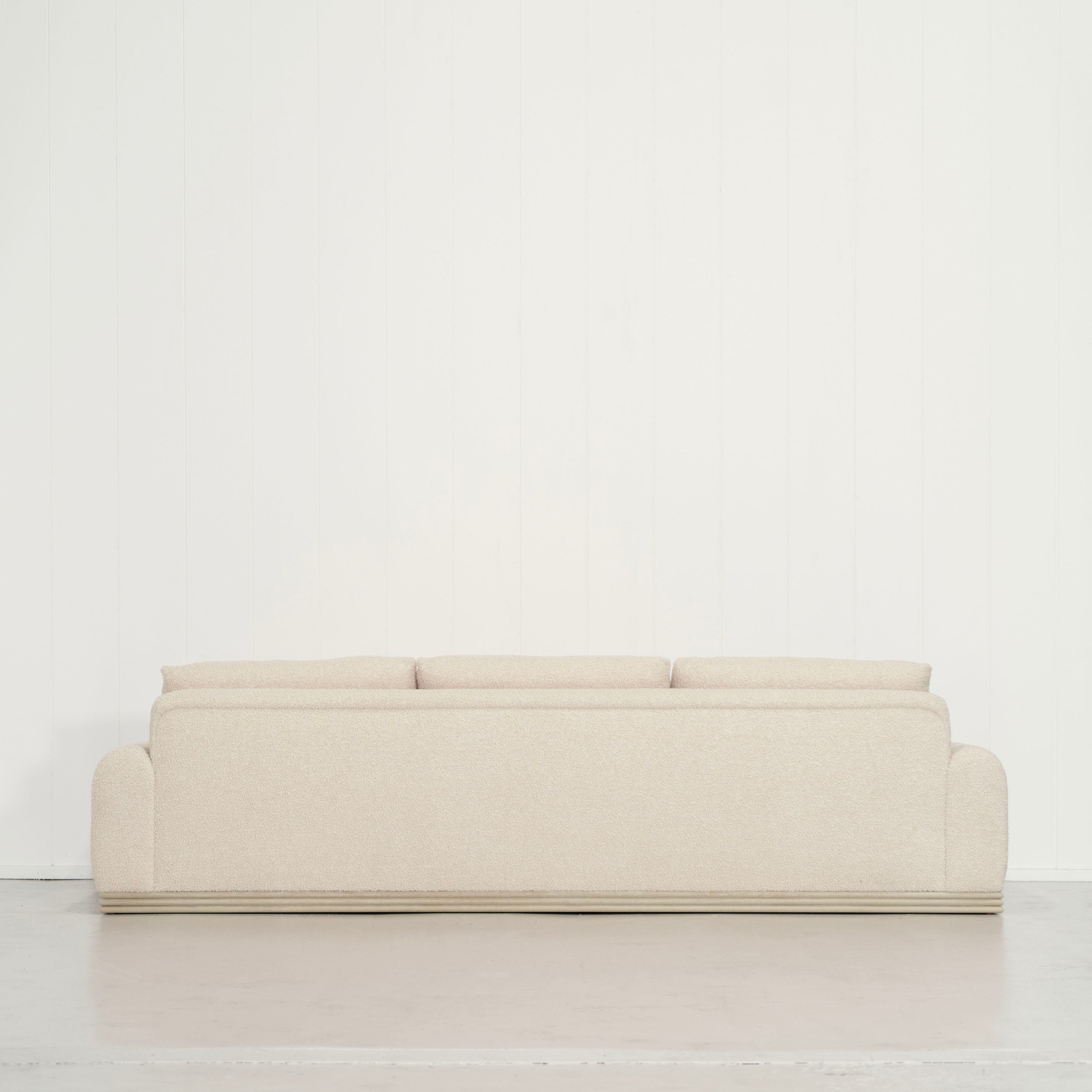 As Shown: 135"W x 42"D x 33"H | Style: Upholstered | Fabric: Teddy Ivory | Finish: Natural