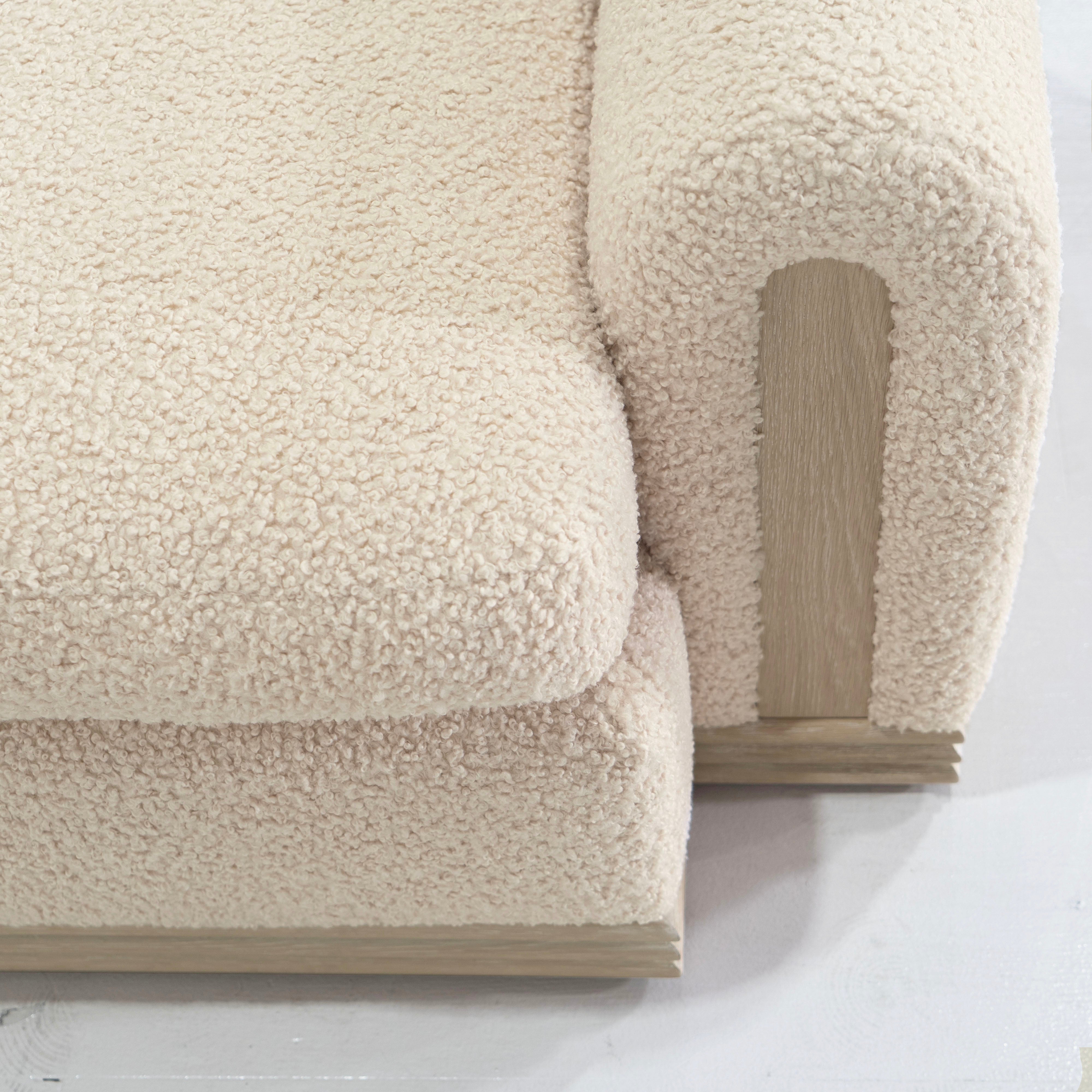 As Shown: 135"W x 42"D x 33"H | Style: Upholstered | Fabric: Teddy Ivory | Finish: Natural