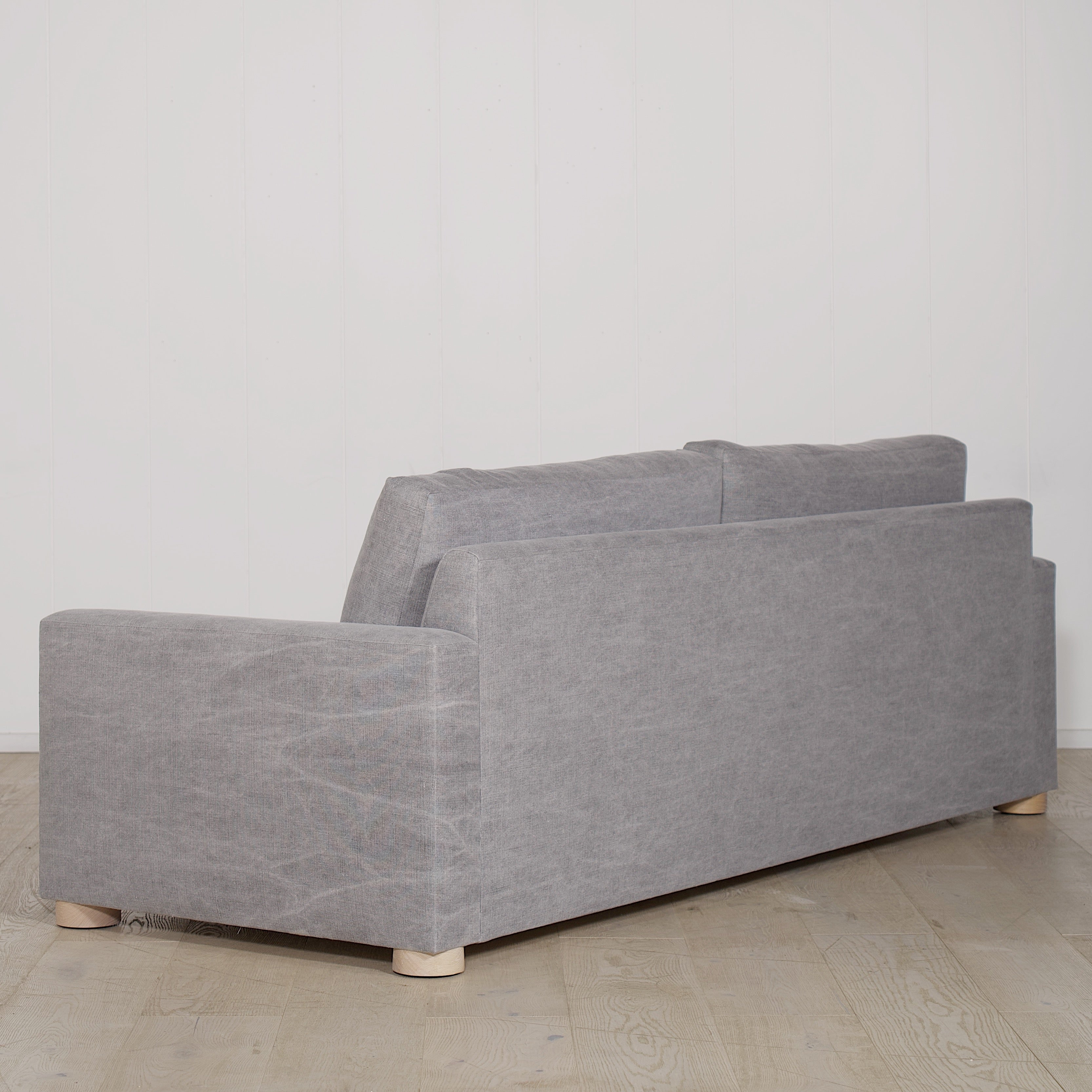 As Shown: in COM fabric, oak legs finished in Mint White Natural.