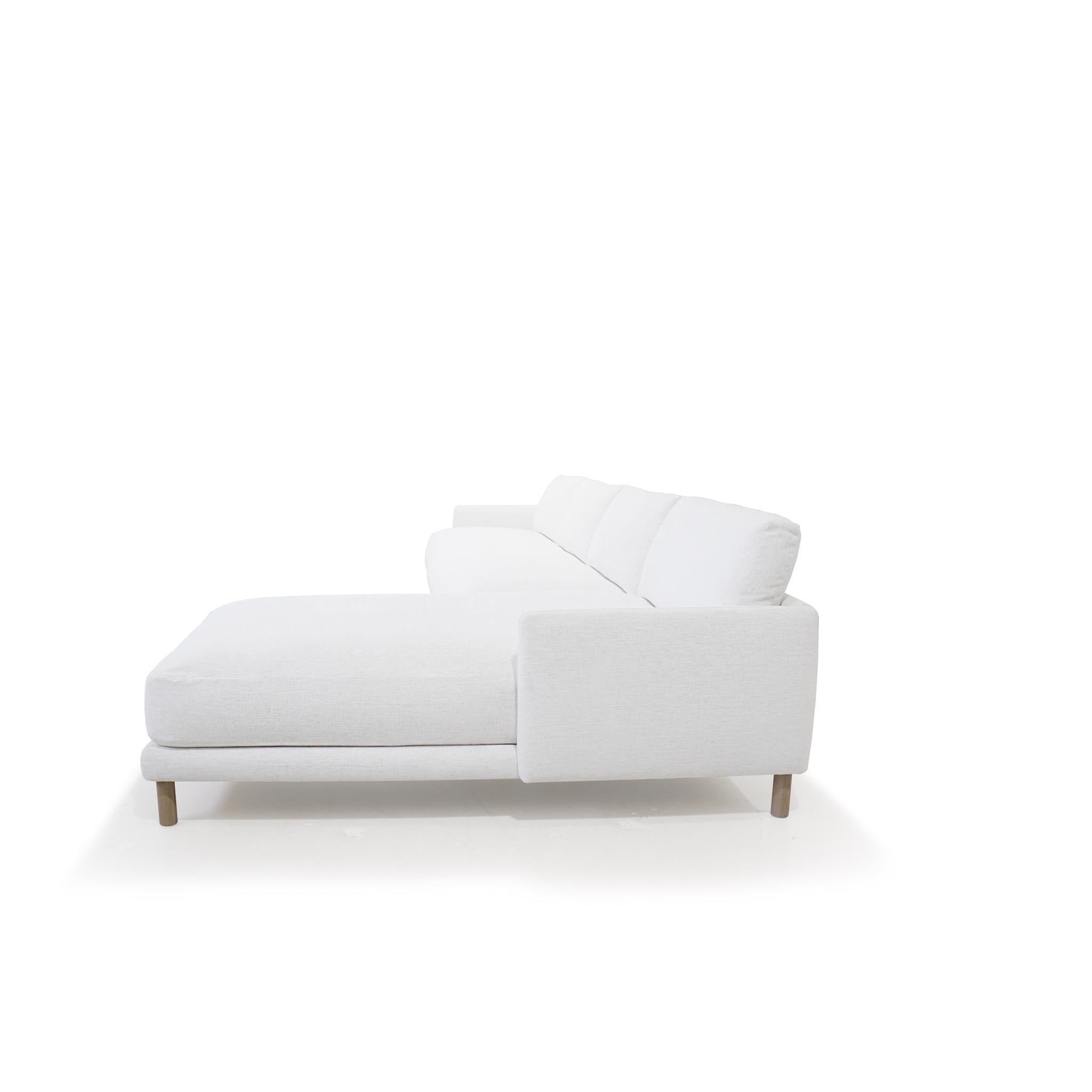 As Shown: in right chaise upholstered in Nomad Snow, oak legs finished in Antique Beige (Discontinued Finish)