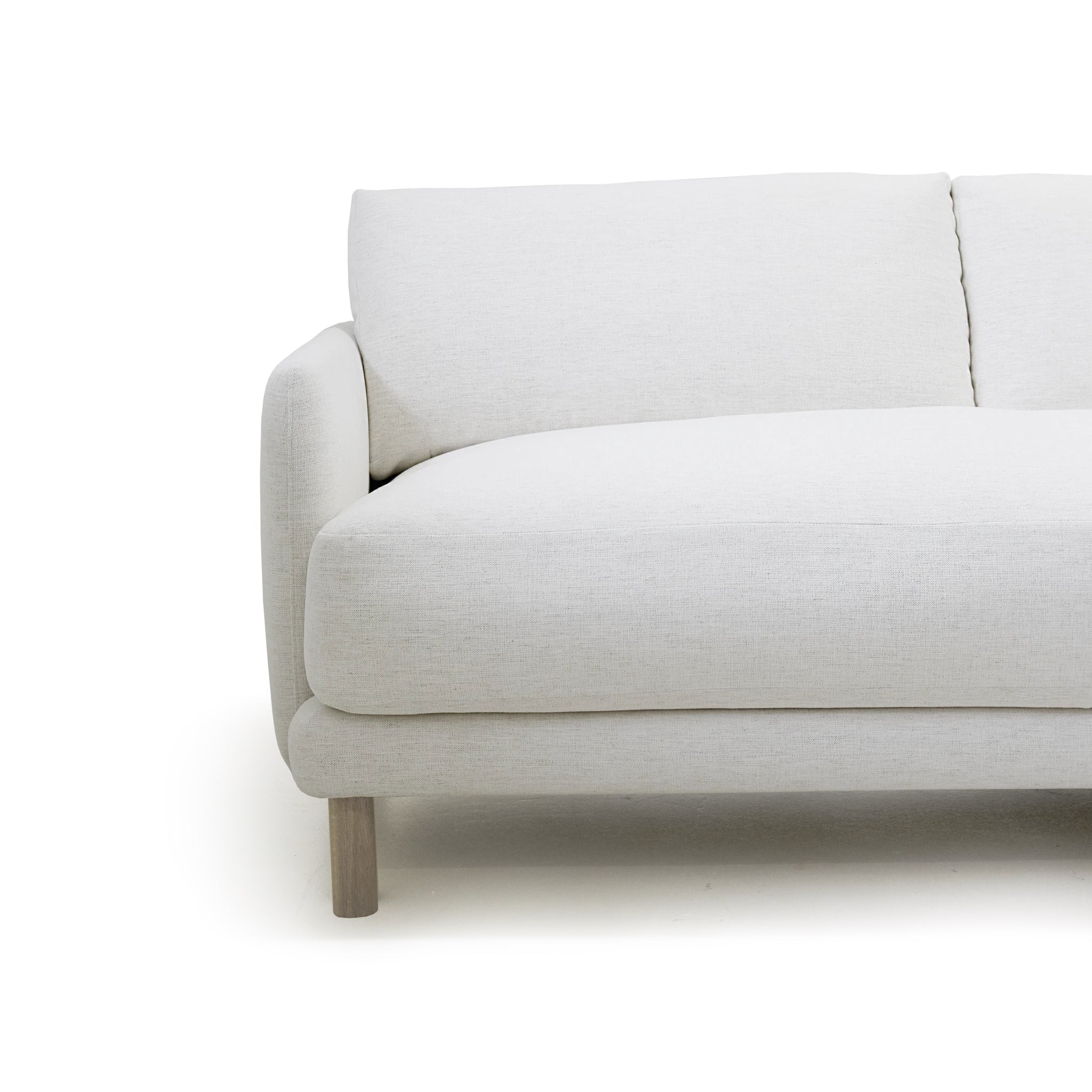 As Shown: in right chaise upholstered in Nomad Snow, oak legs finished in Antique Beige (Discontinued Finish)