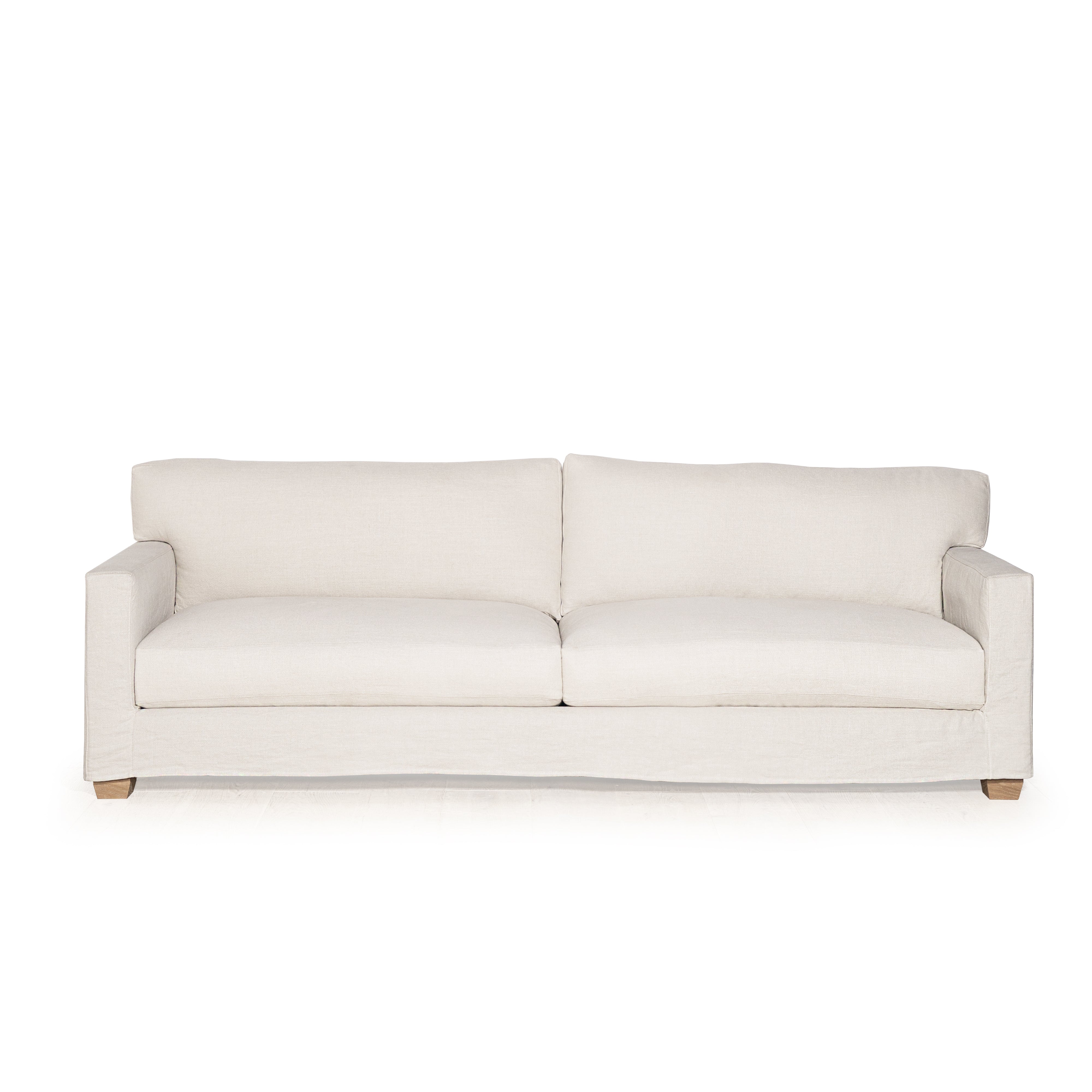 As Shown: in Large, short slipcovered in Fresno Sand, oak legs in custom finish