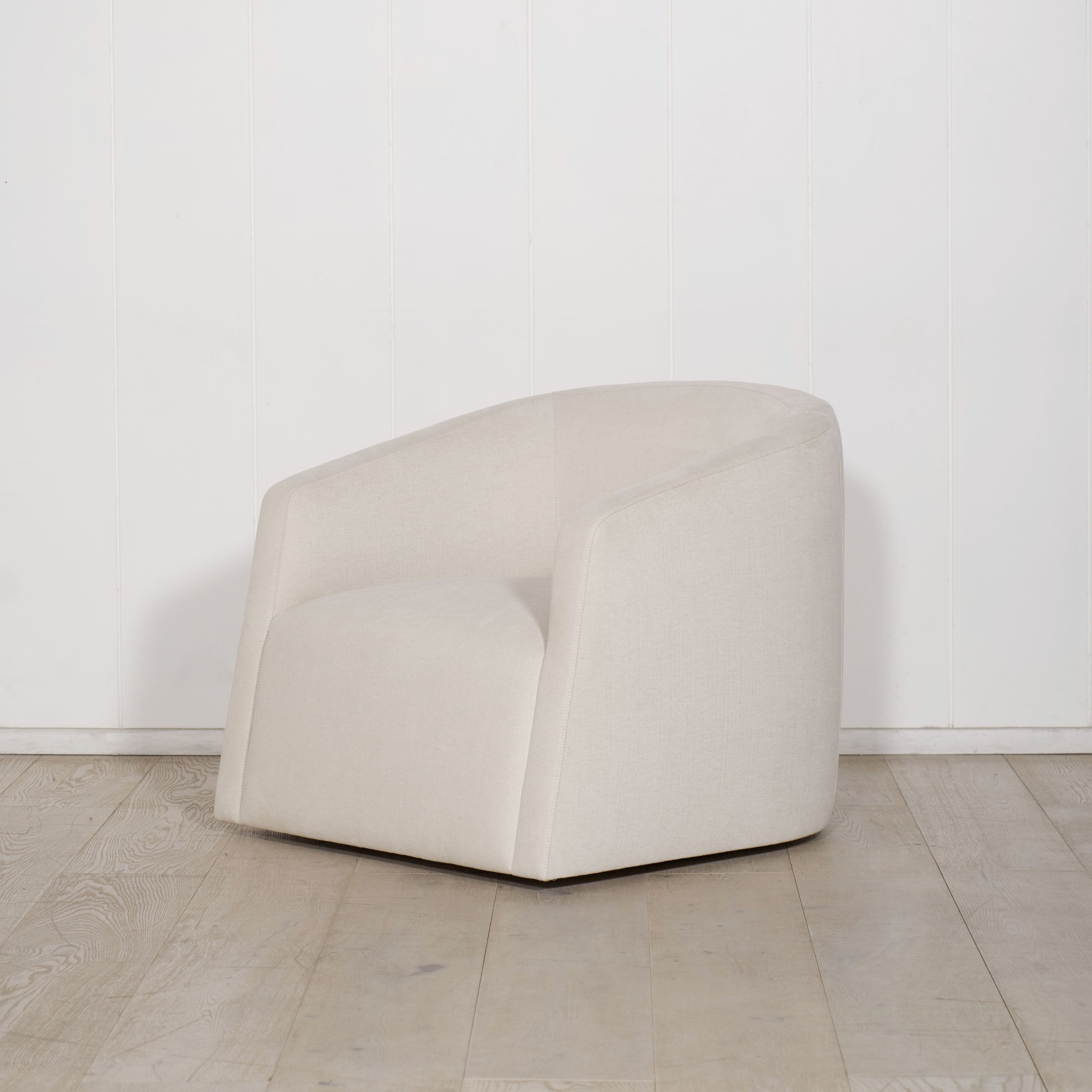As Shown: in upholstered Parker Sand, swivel.