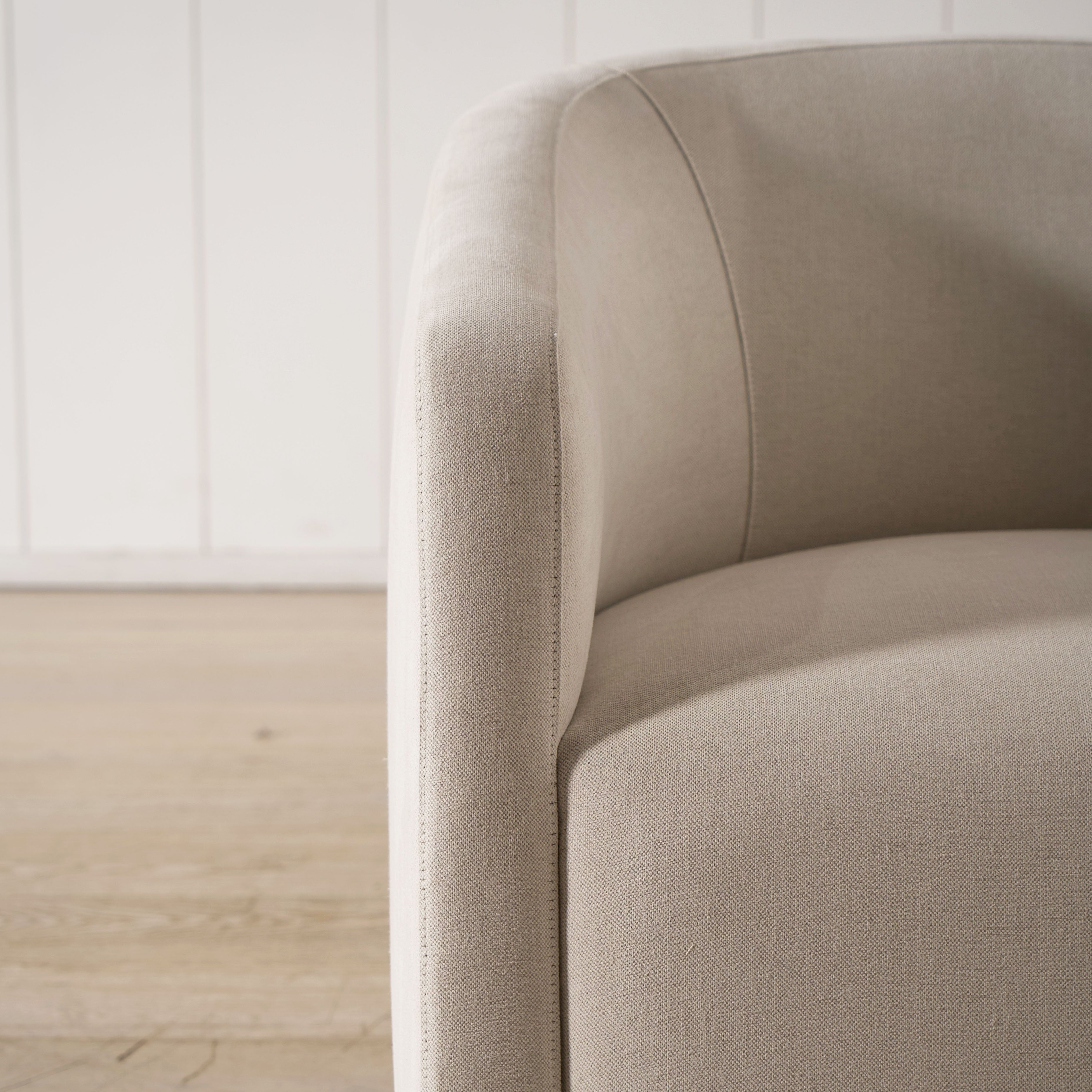 As Shown: in upholstered Parker Sand, swivel.