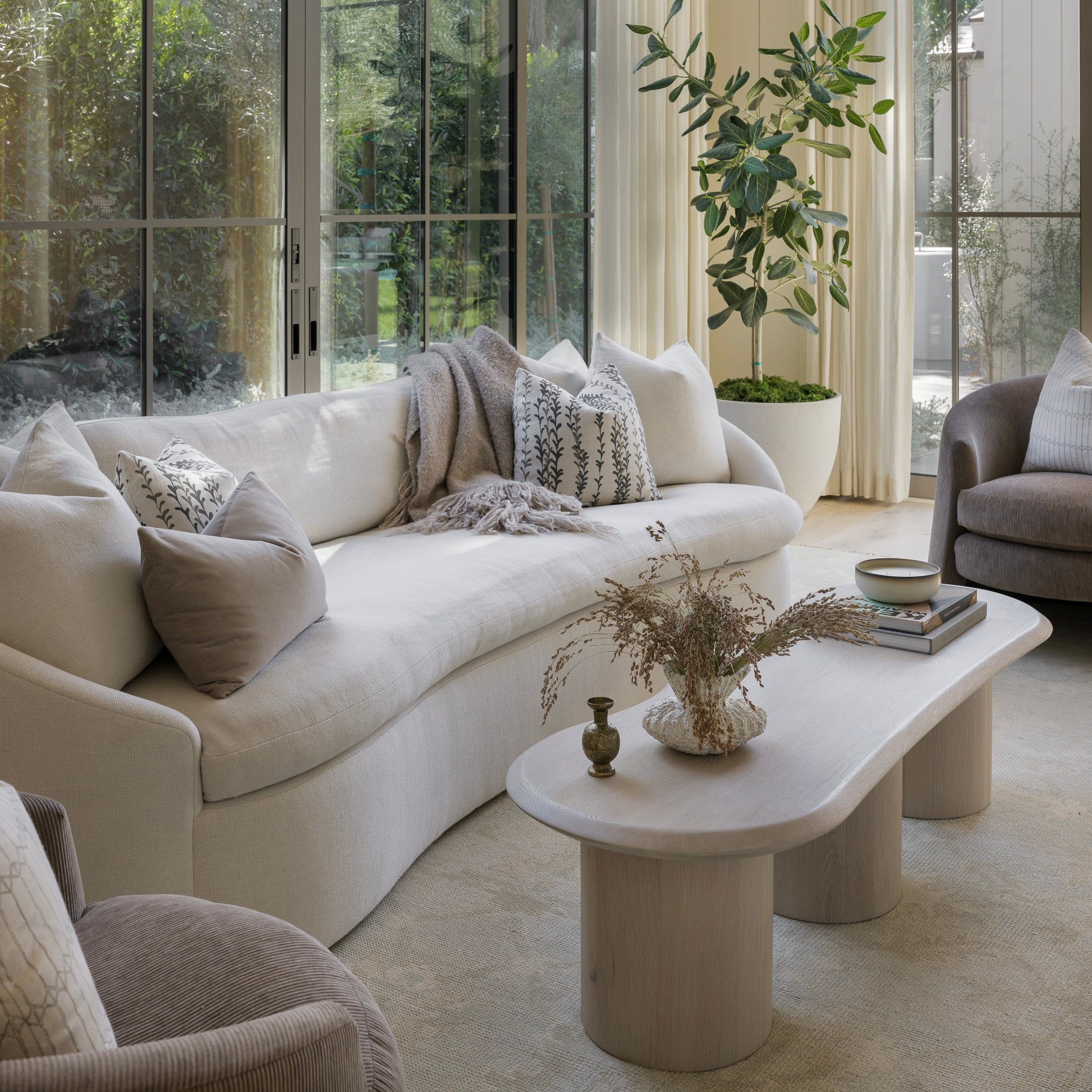 As Shown: in upholstered Zion Custard, oak legs finished in Mint White Natural.