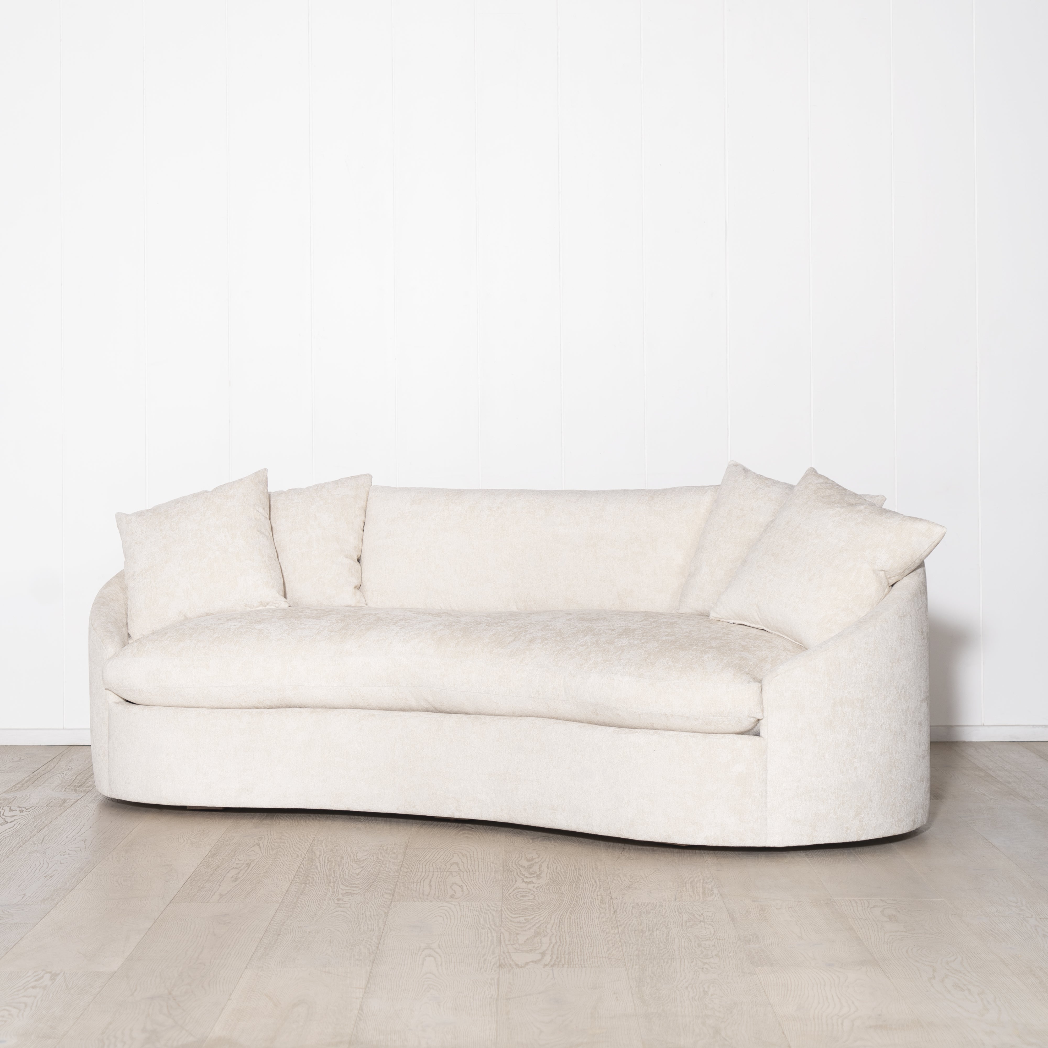 As Shown: in upholstered Zion Custard, oak legs finished in Mint White Natural.