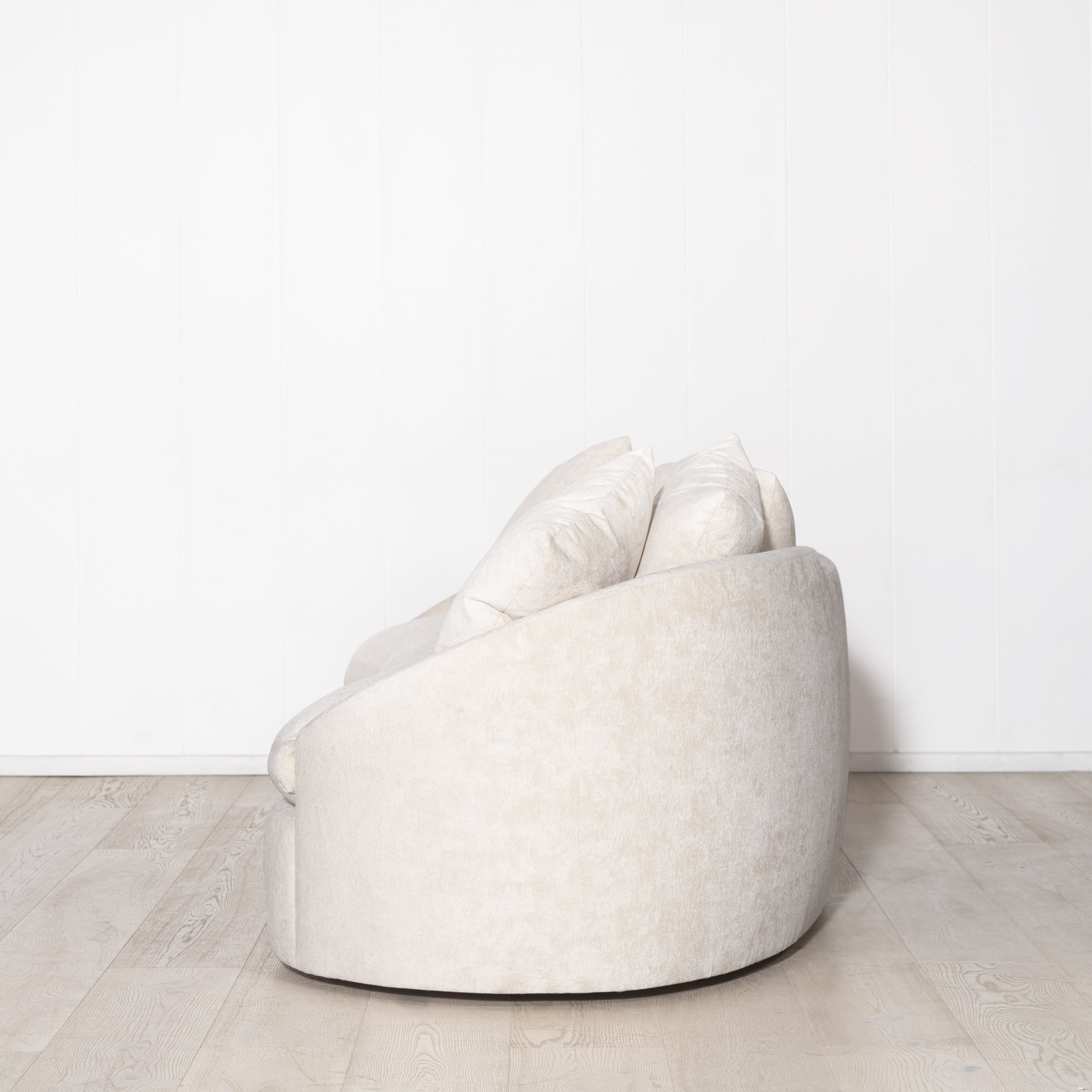 As Shown: in upholstered Zion Custard, oak legs finished in Mint White Natural.