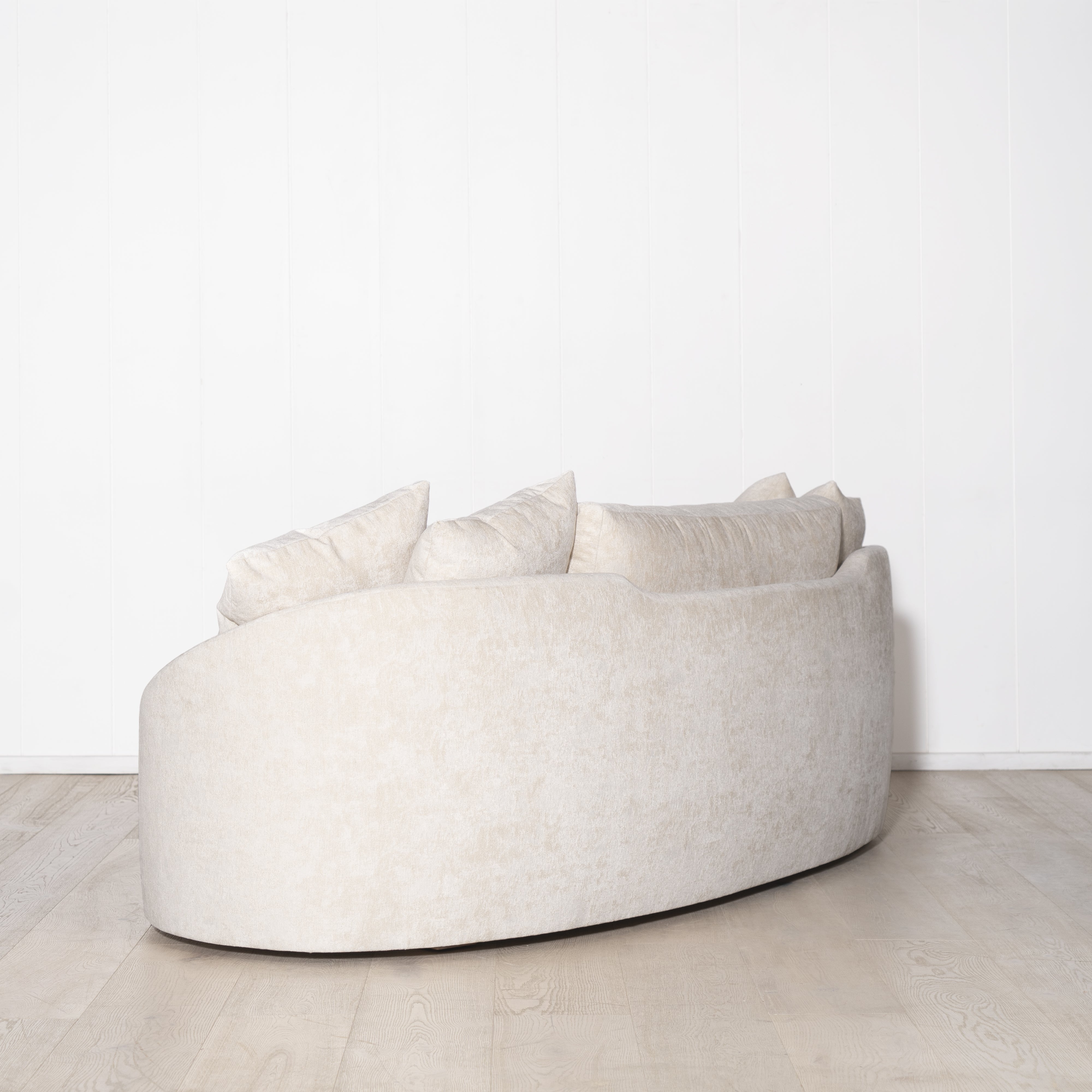 As Shown: in upholstered Zion Custard, oak legs finished in Mint White Natural.