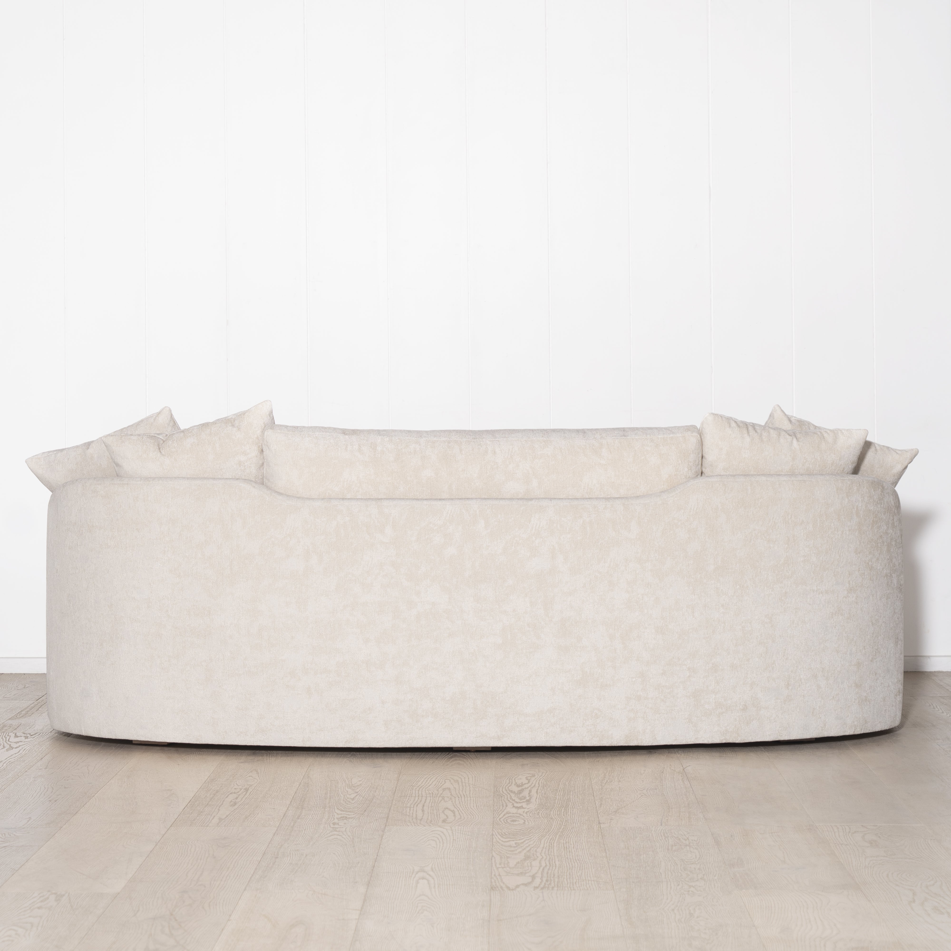 As Shown: in upholstered Zion Custard, oak legs finished in Mint White Natural.