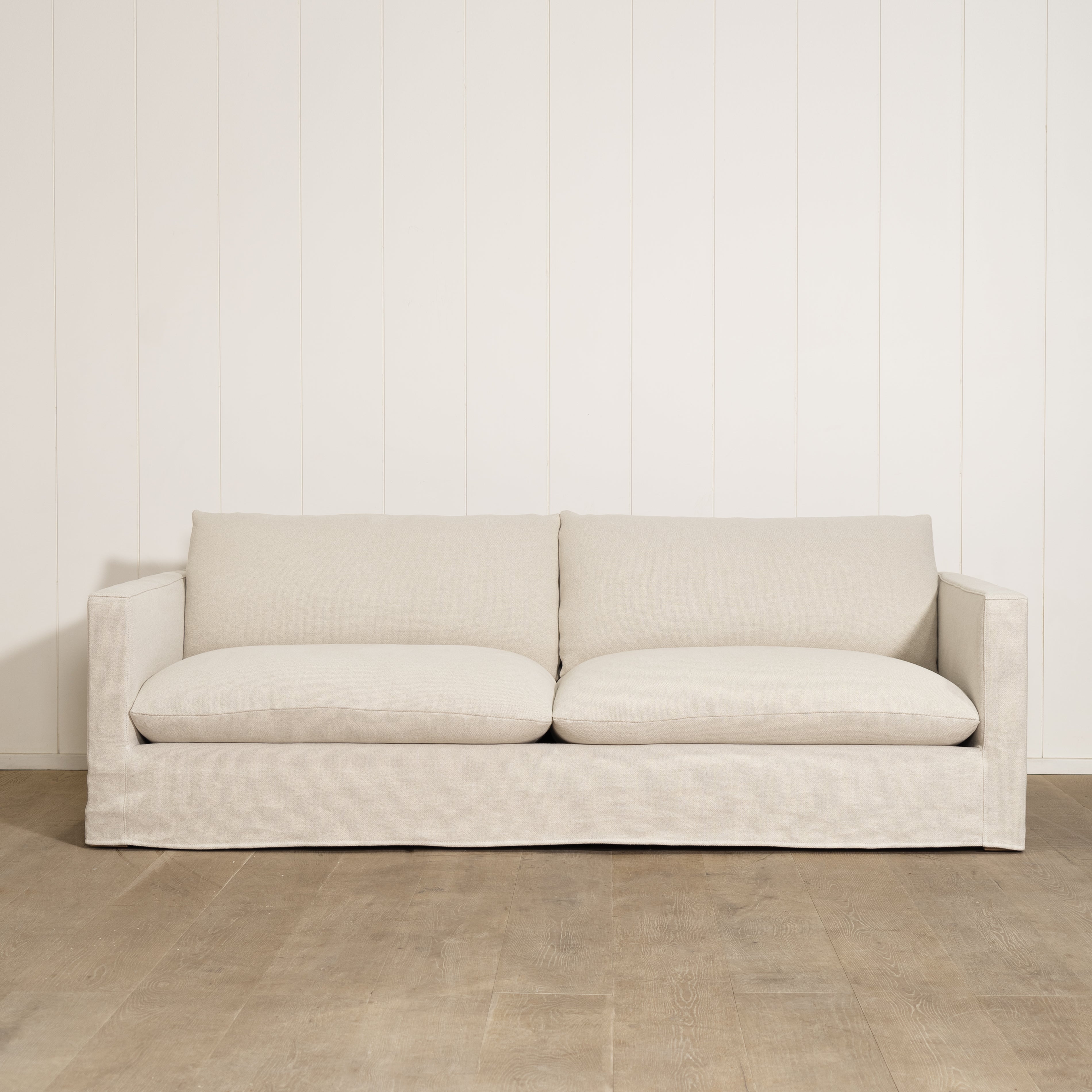 As Shown: Slipcovered in Frame Natural with a 2 over 2 Cushion Configuration