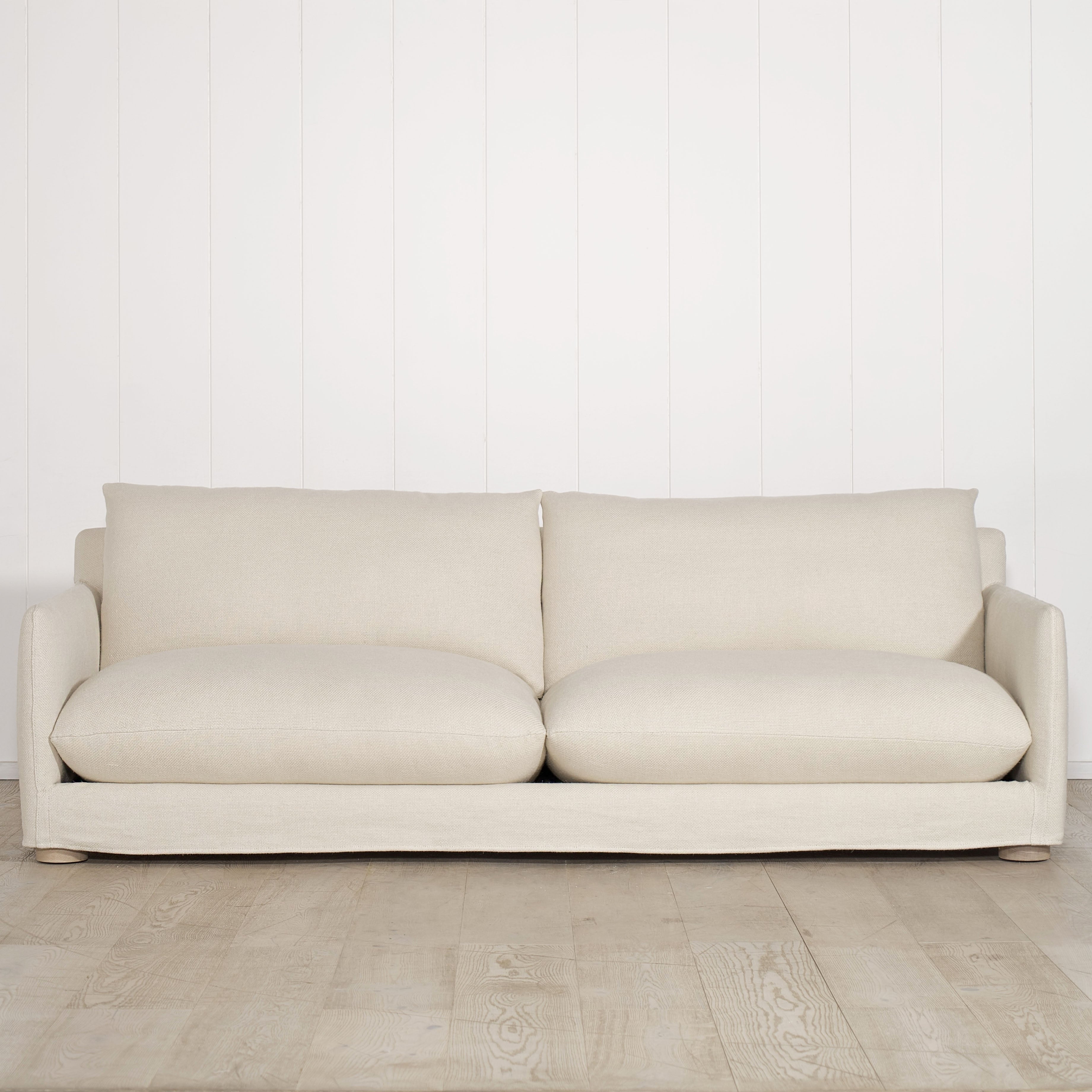As Shown: Slipcovered in Monte Natural with legs finishing in Mint White Natural