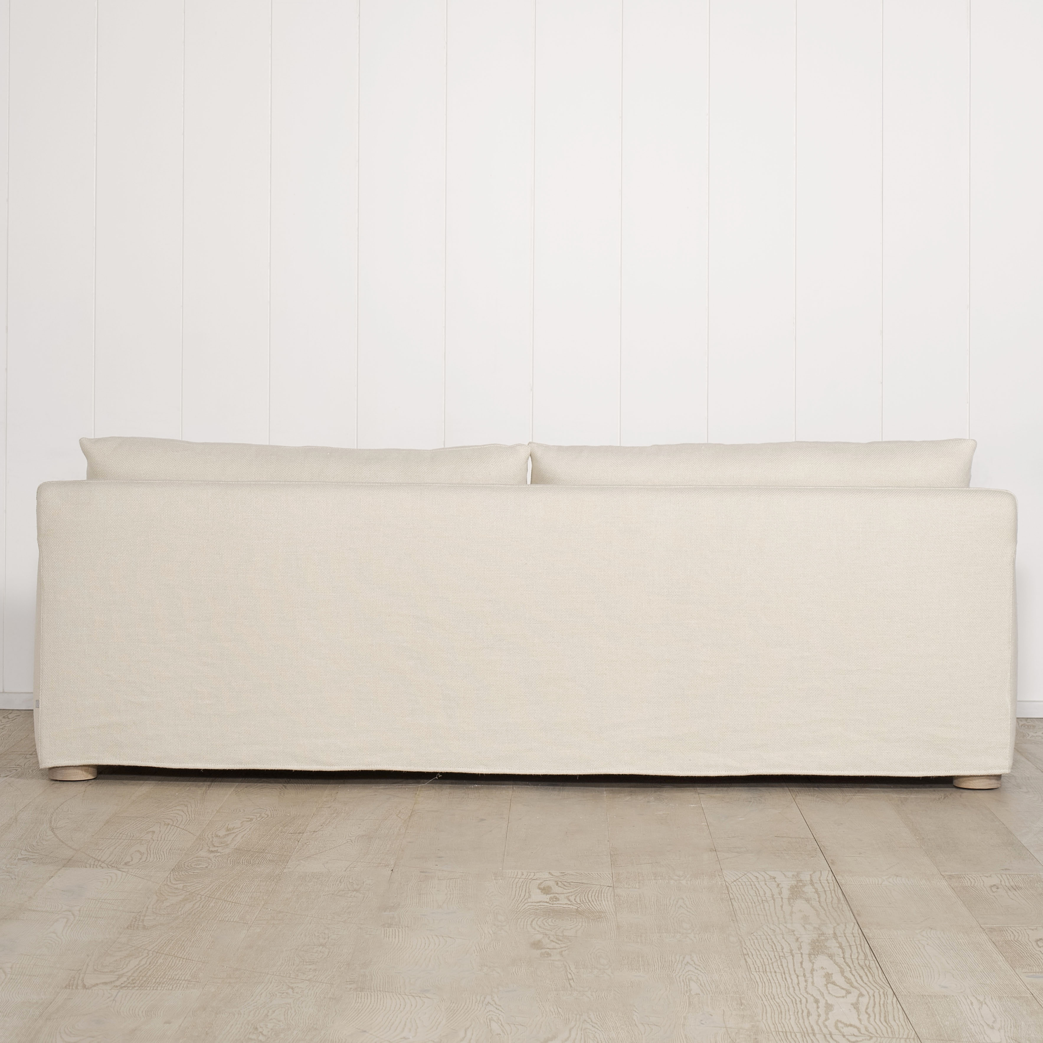 As Shown: Slipcovered in Monte Natural with legs finishing in Mint White Natural