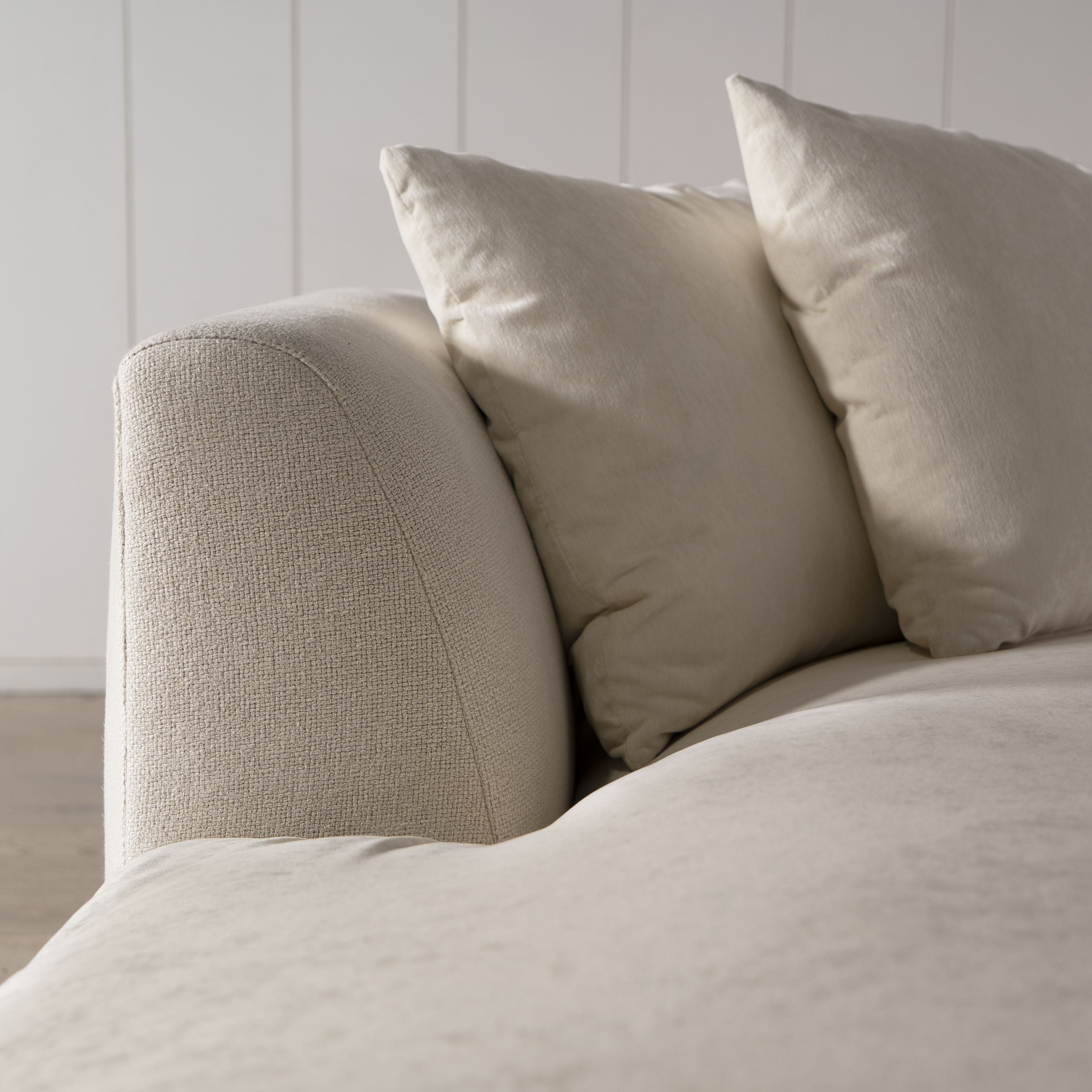 As Shown: Upholstered in COM with Lincoln Parchment seat cushions and pillows. Last variant in Belgian Sky Blue.Oak legs finished in Mint White Natural.