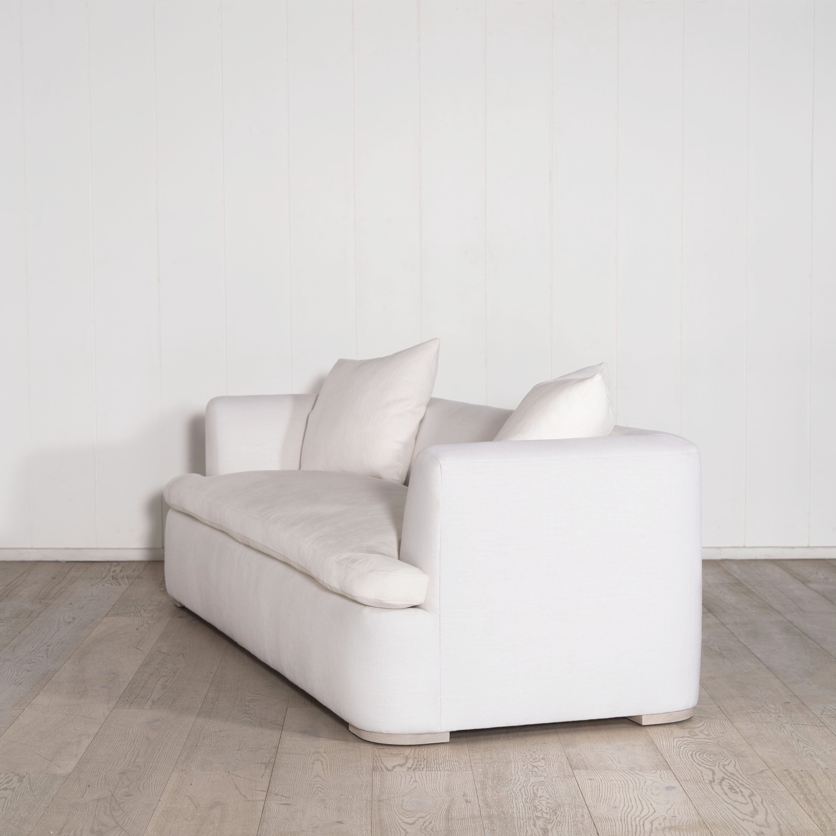 As Shown: in com fabrics, oak legs finished in Mint White Natural.