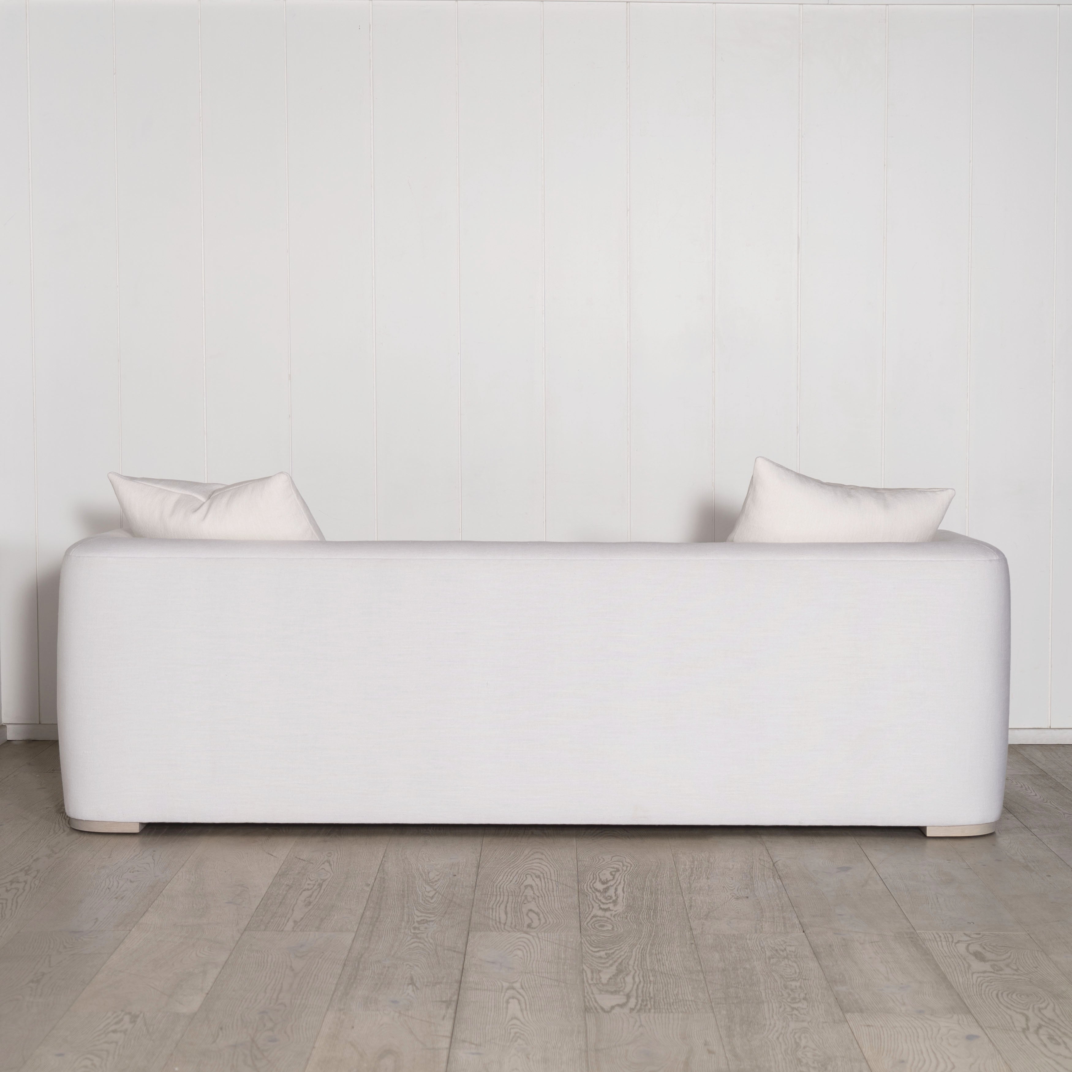 As Shown: in com fabrics, oak legs finished in Mint White Natural.