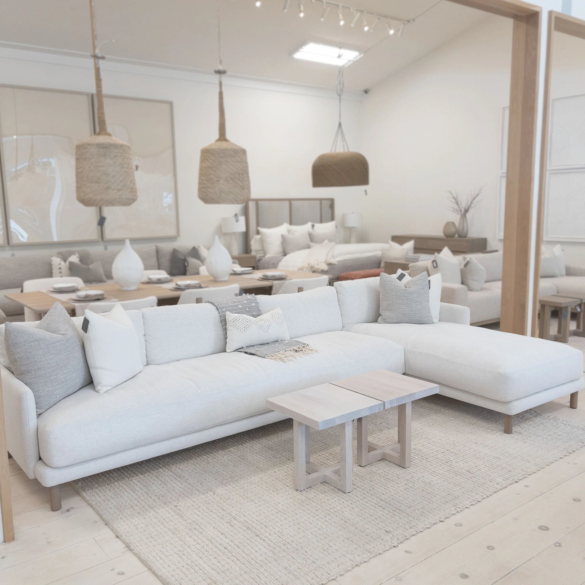 As Shown: in right chaise upholstered in Nomad Snow, oak legs finished in Antique Beige (Discontinued Finish)